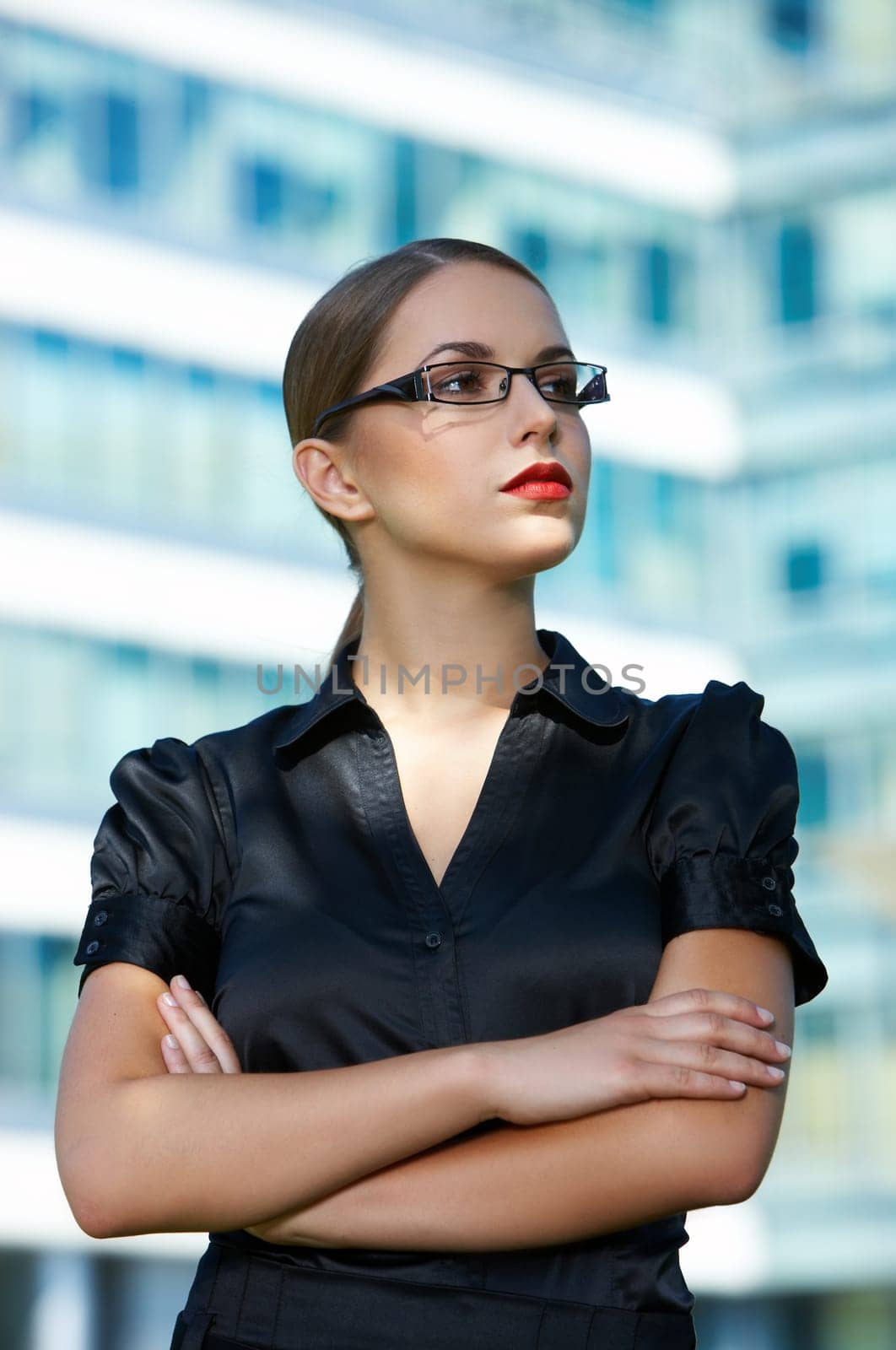 Beautiful business woman standing outdoor modern building