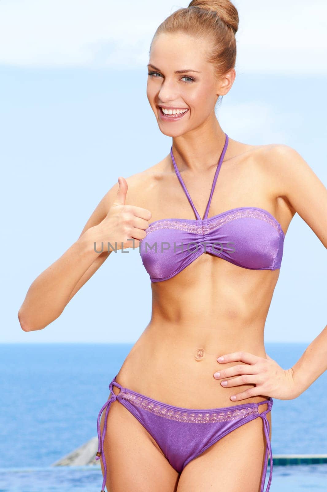 Portrait of happy woman with thumb up gesture