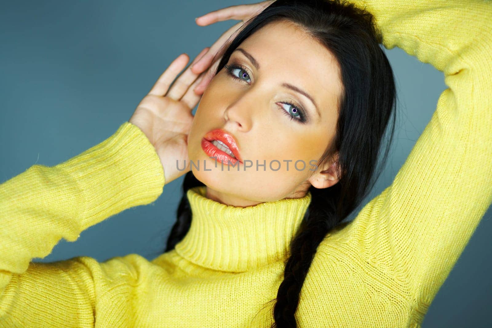 Portrait of beautiful woman wearing yellow sweater