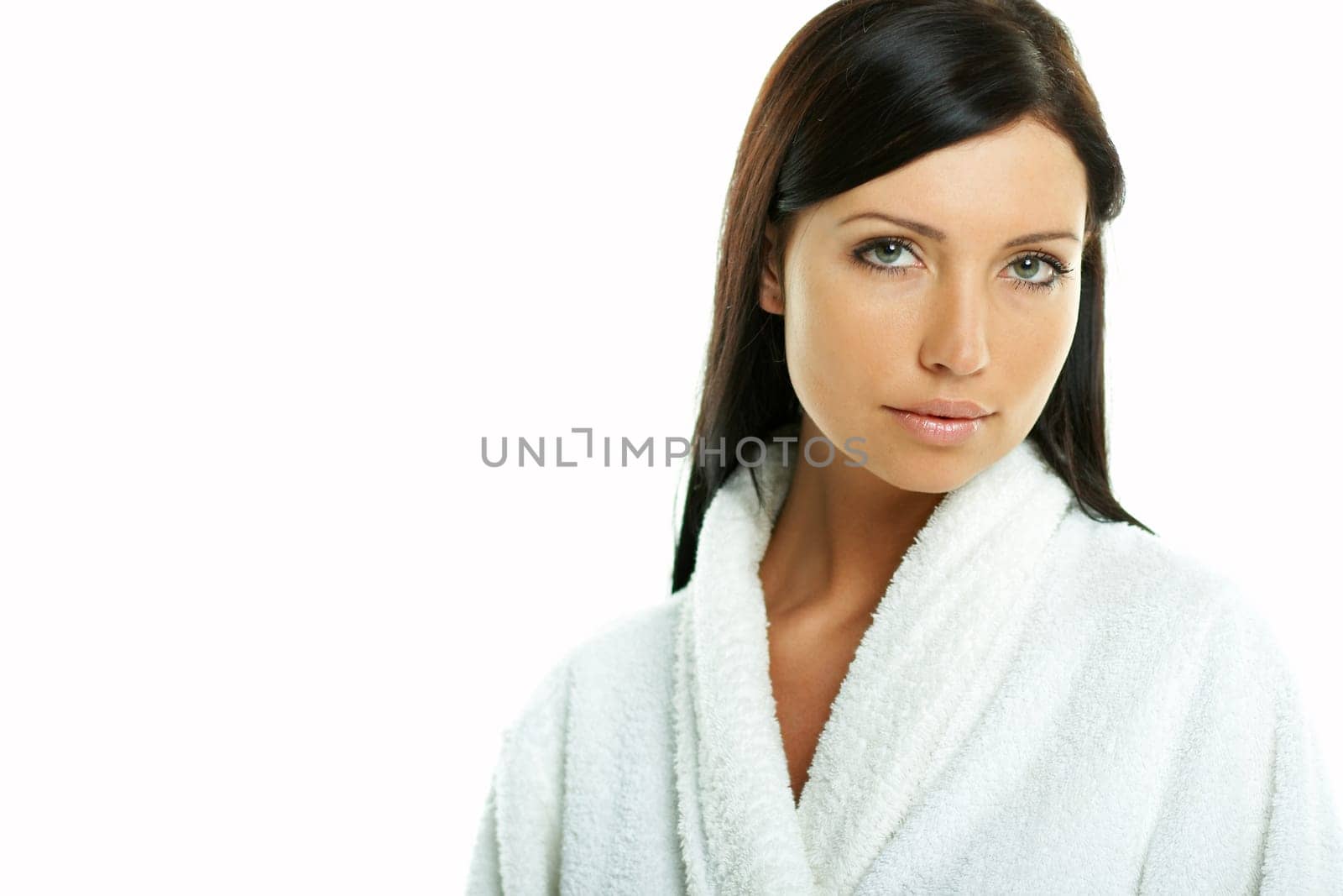 Portrait of Fresh and Beautiful brunette woman on white background wearing white bathrobe