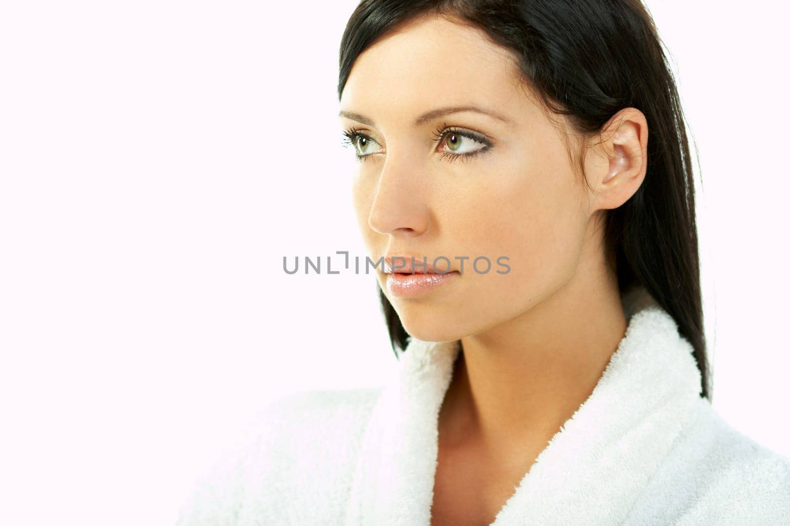 Portrait of Fresh and Beautiful brunette woman on white background wearing white bathrobe