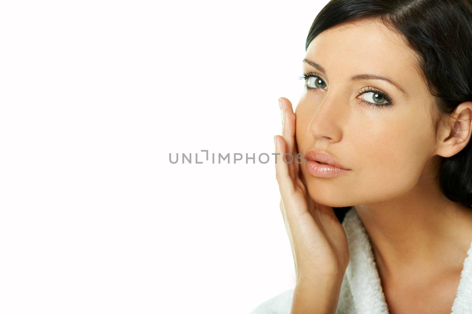 Portrait of Fresh and Beautiful brunette woman on white background wearing white bathrobe