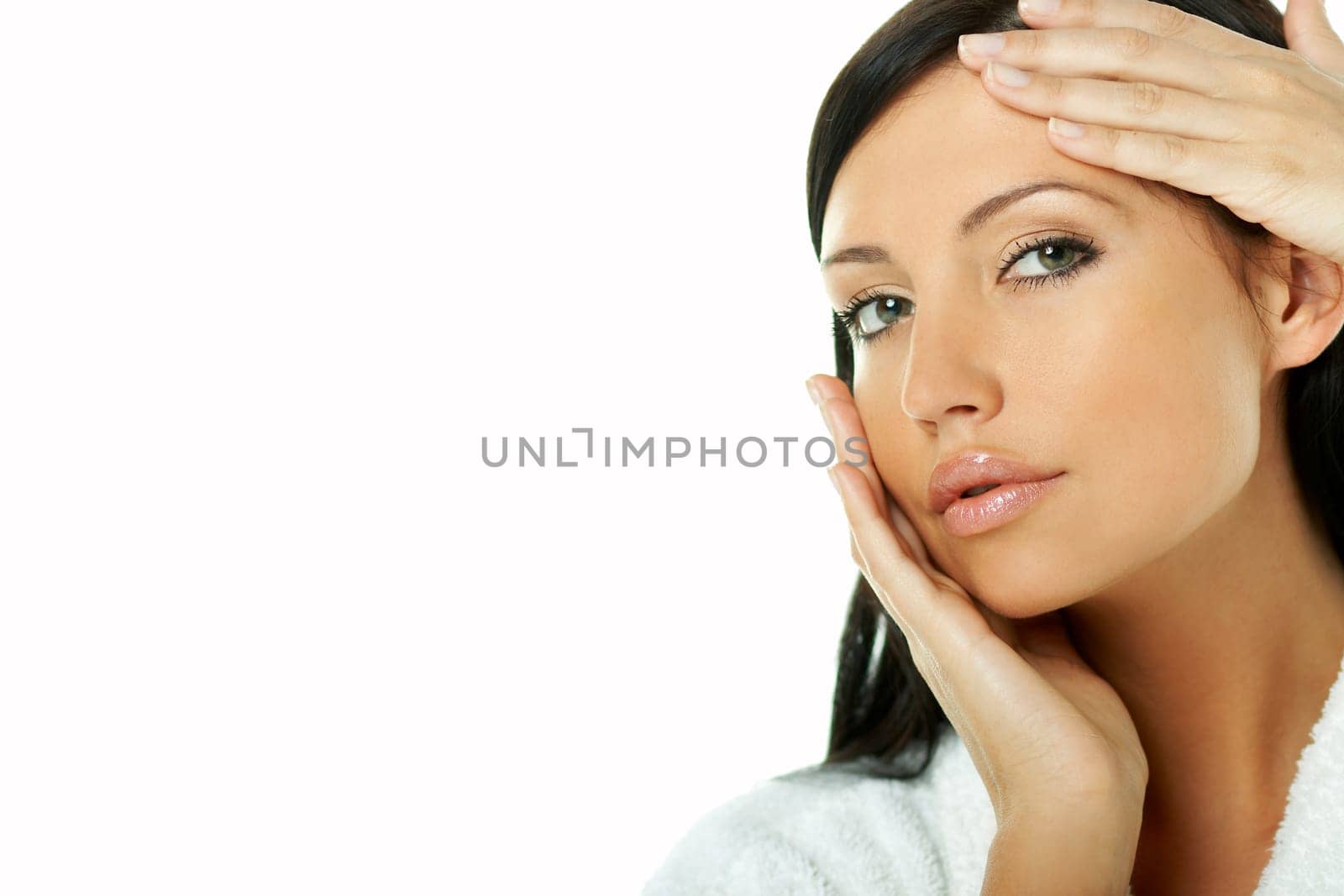 Portrait of Fresh and Beautiful brunette woman on white background wearing white bathrobe