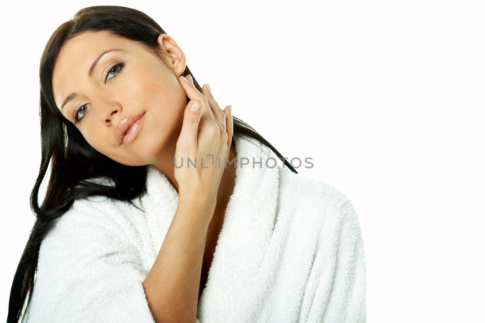 Portrait of Fresh and Beautiful brunette woman on white background wearing white bathrobe