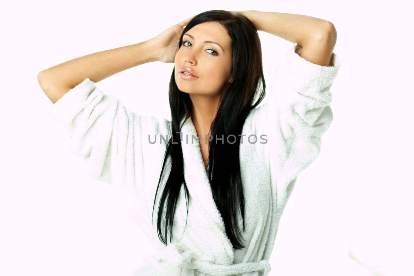 Portrait of Fresh and Beautiful brunette woman on white background wearing white bathrobe
