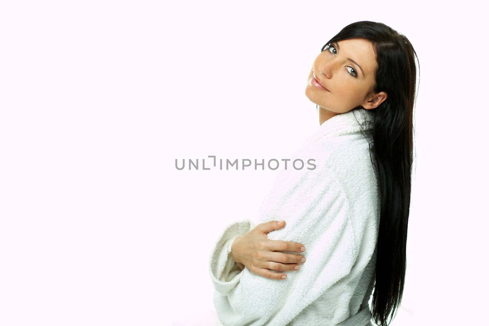 Portrait of Fresh and Beautiful brunette woman on white background wearing white bathrobe