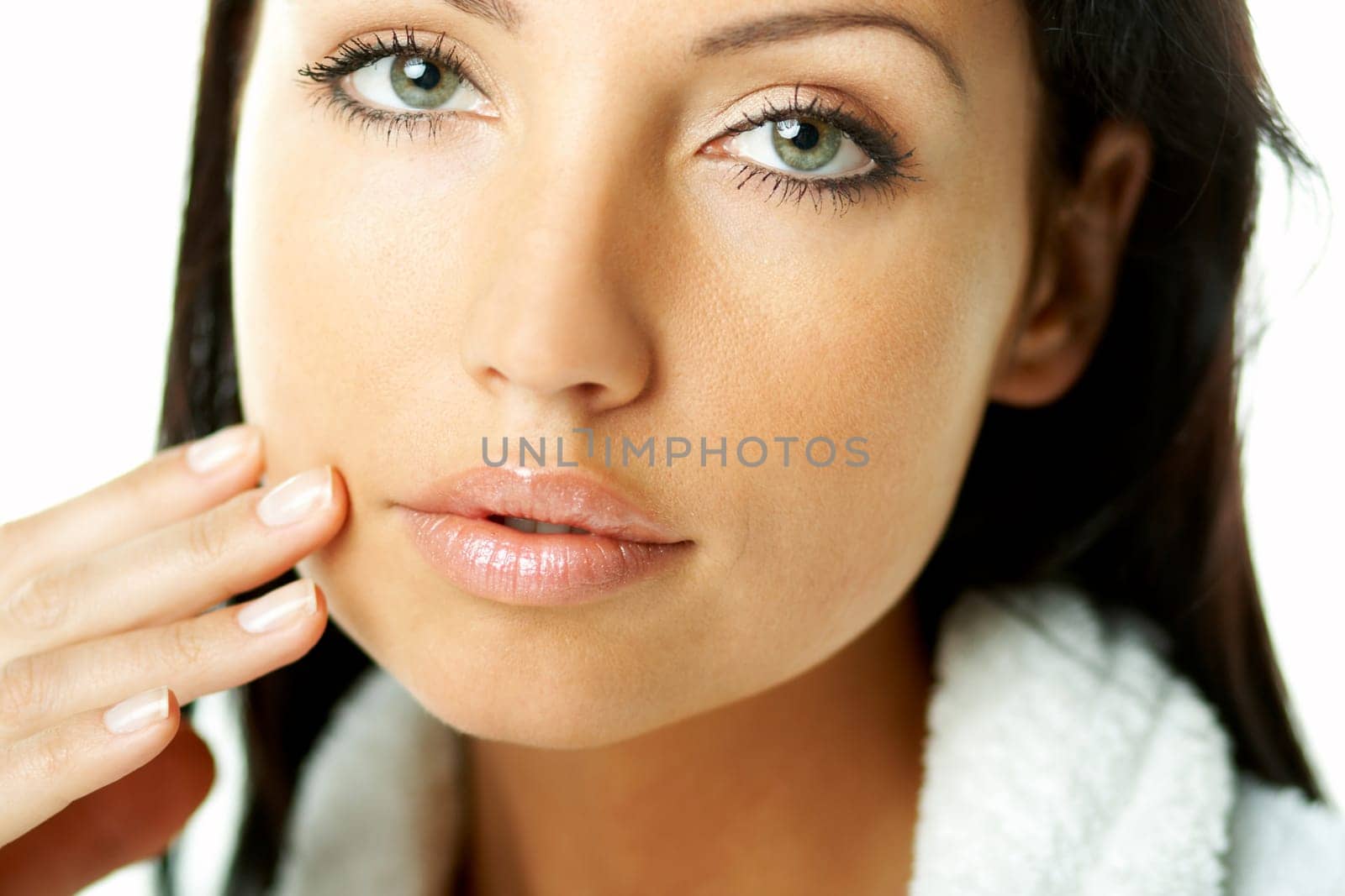 Portrait of Fresh and Beautiful brunette woman on white background wearing white bathrobe