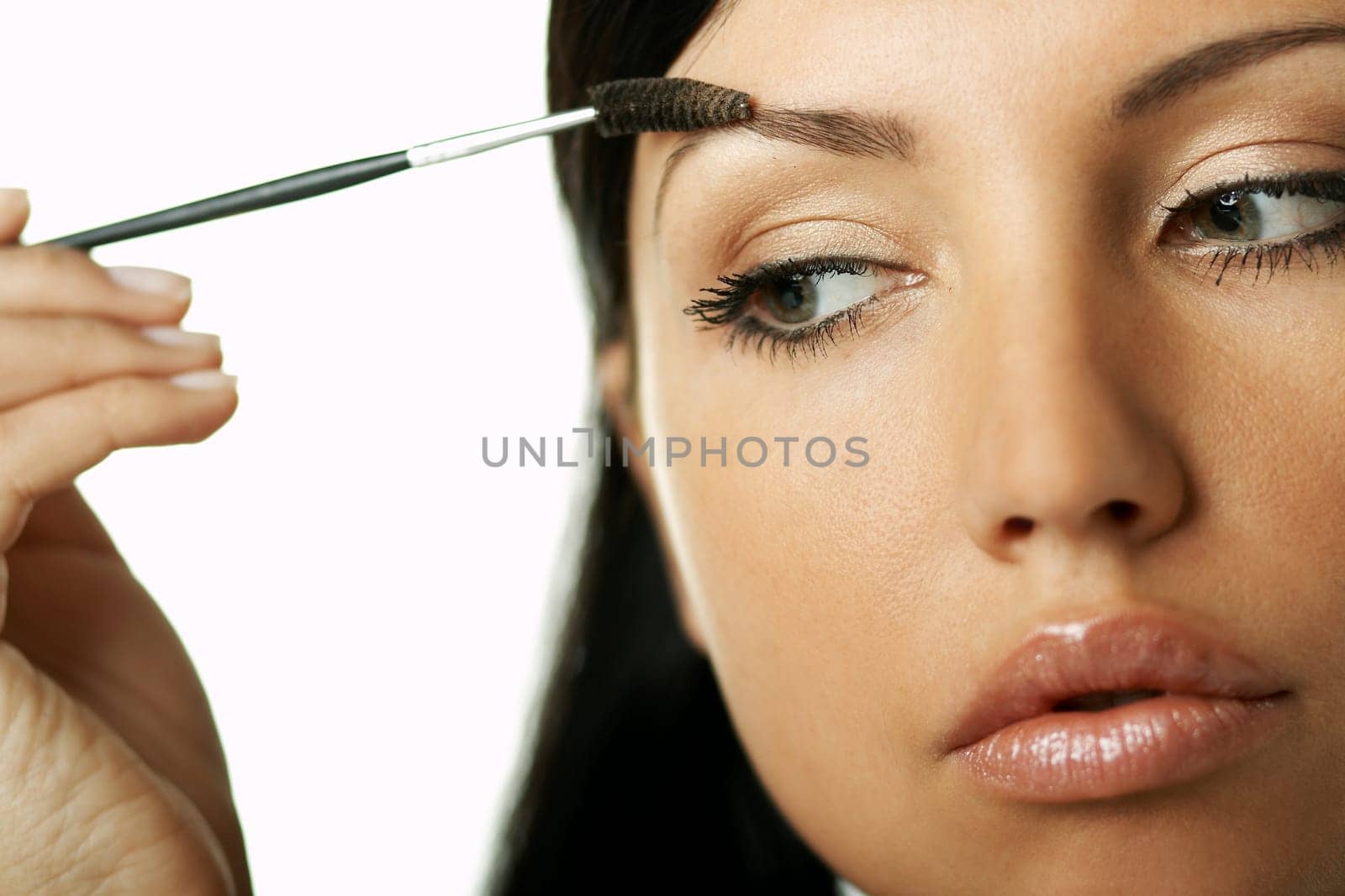 Portrait of Beautiful brunette woman doing daily morning routines (the make up series)