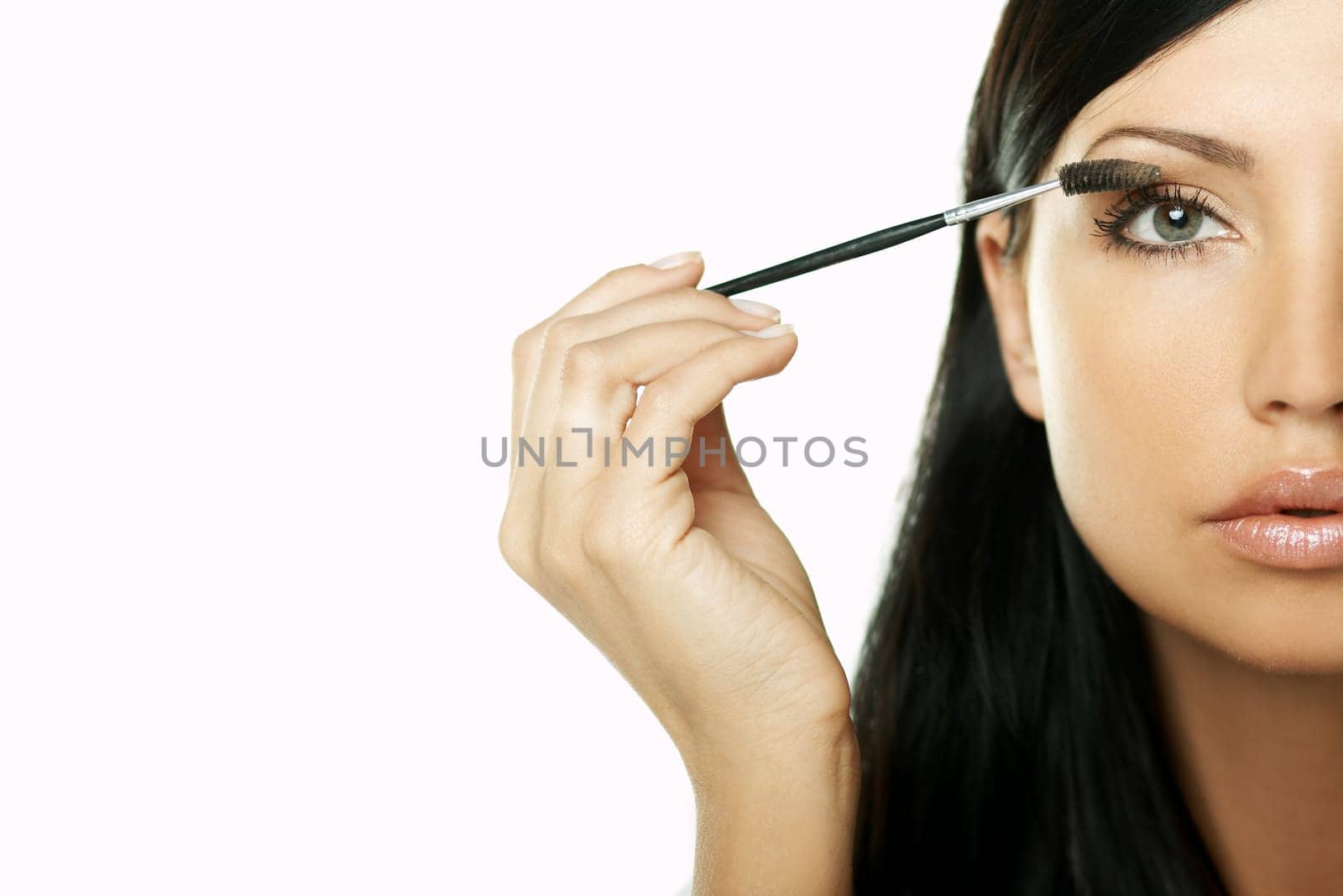 Portrait of Beautiful brunette woman doing daily morning routines (the make up series)