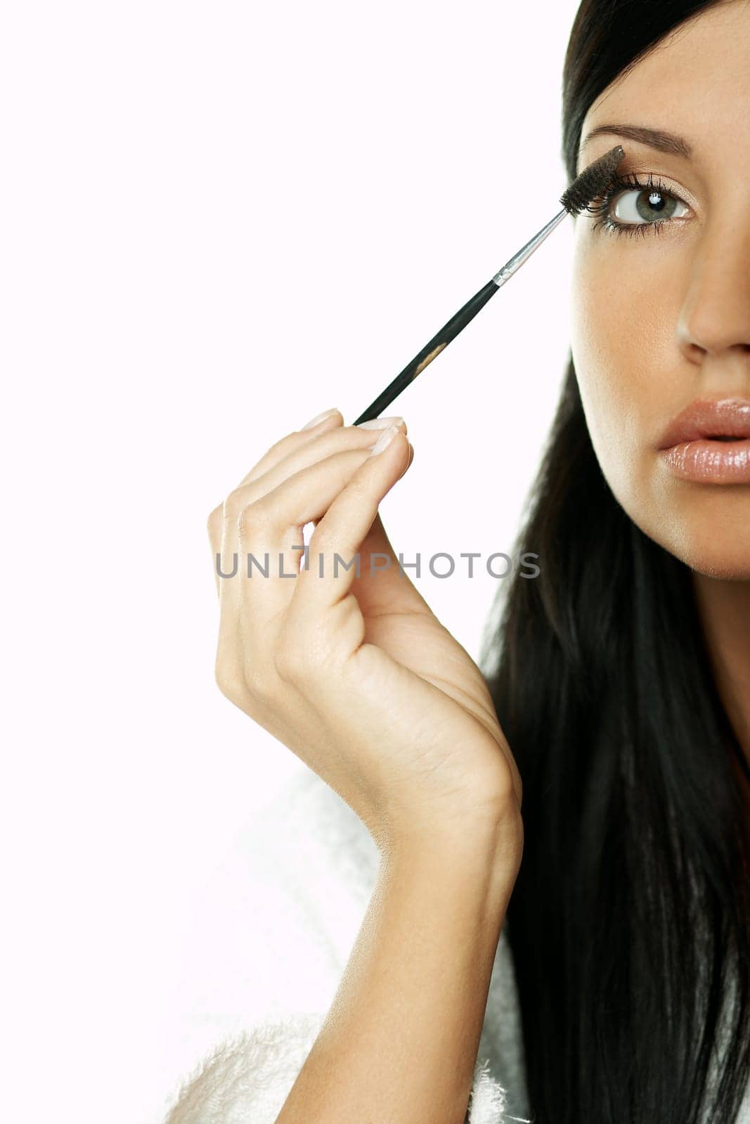 Portrait of Beautiful brunette woman doing daily morning routines (the make up series)