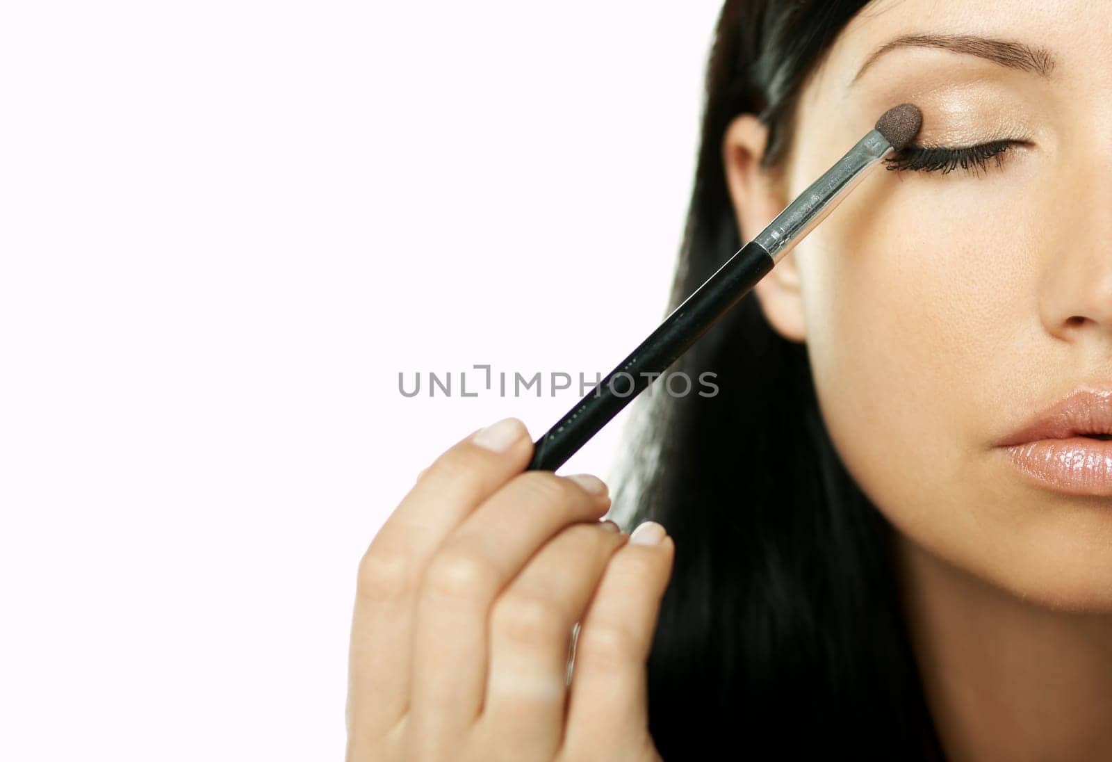 Portrait of Beautiful brunette woman doing daily morning routines (the make up series)