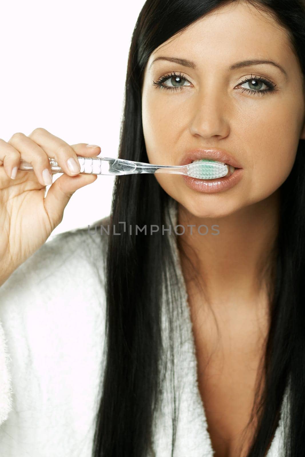 Portrait of Beautiful brunette woman doing daily morning routines (the make up series)