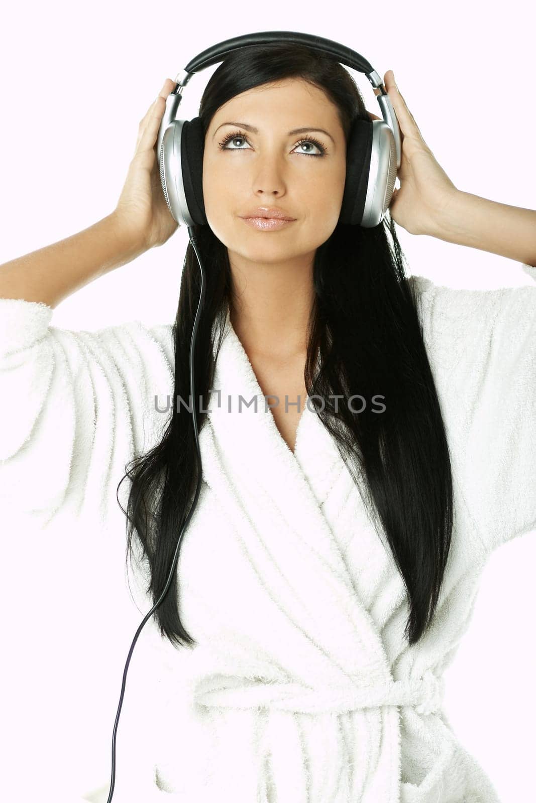 Portrait of Beautiful brunette woman listen to music with headphones