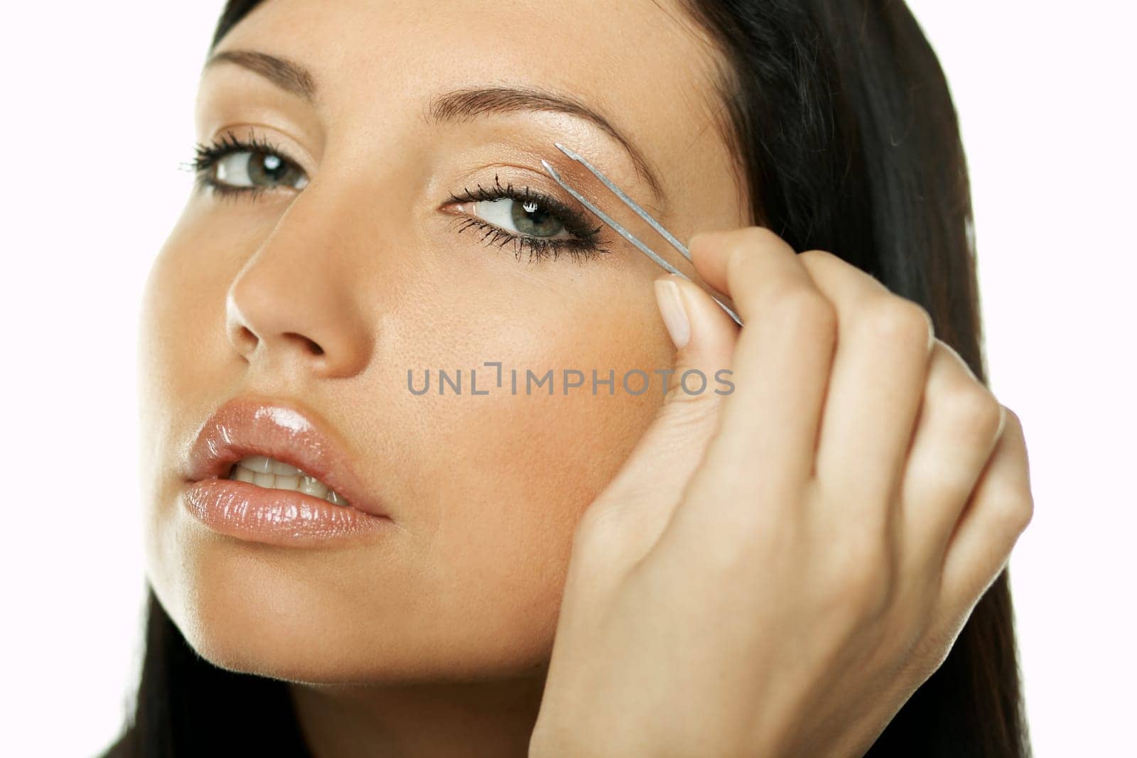 Portrait of Beautiful brunette woman doing daily morning routines (the make up series)