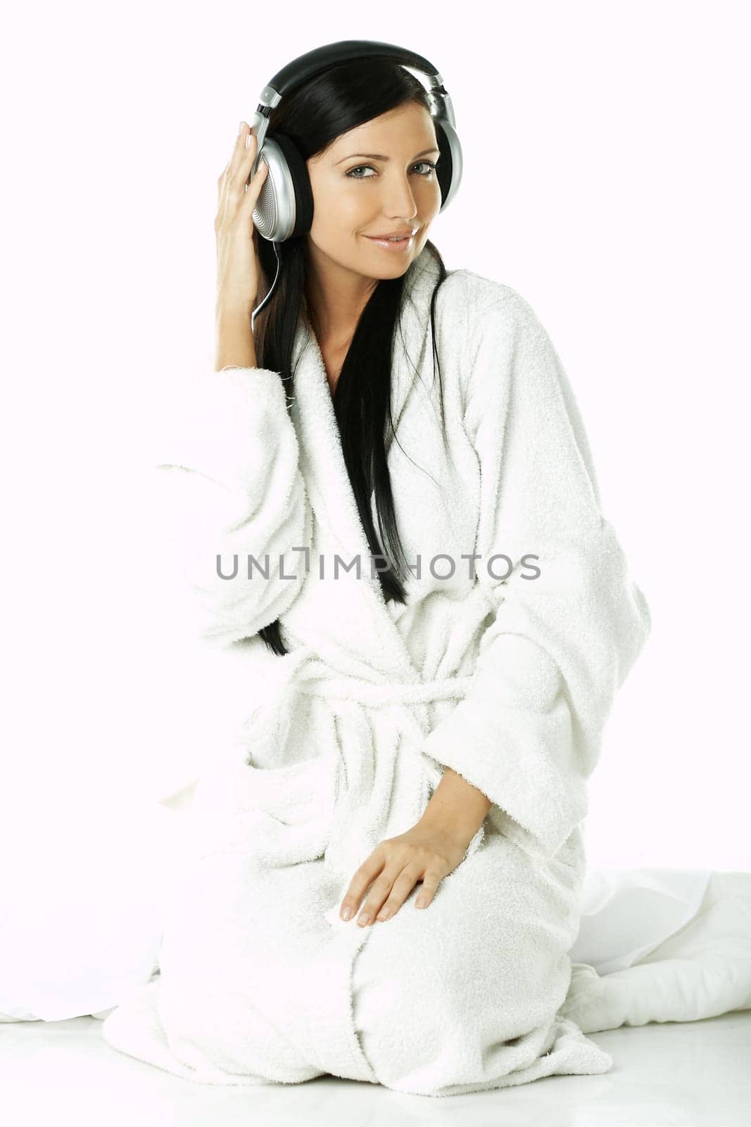 Portrait of Beautiful brunette woman listen to music with headphones