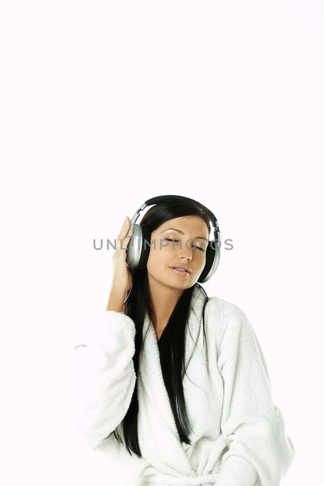 Portrait of Beautiful brunette woman listen to music with headphones