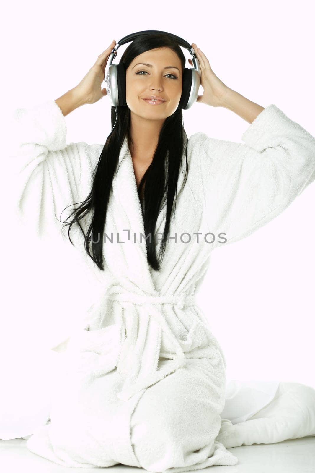 Portrait of Beautiful brunette woman listen to music with headphones
