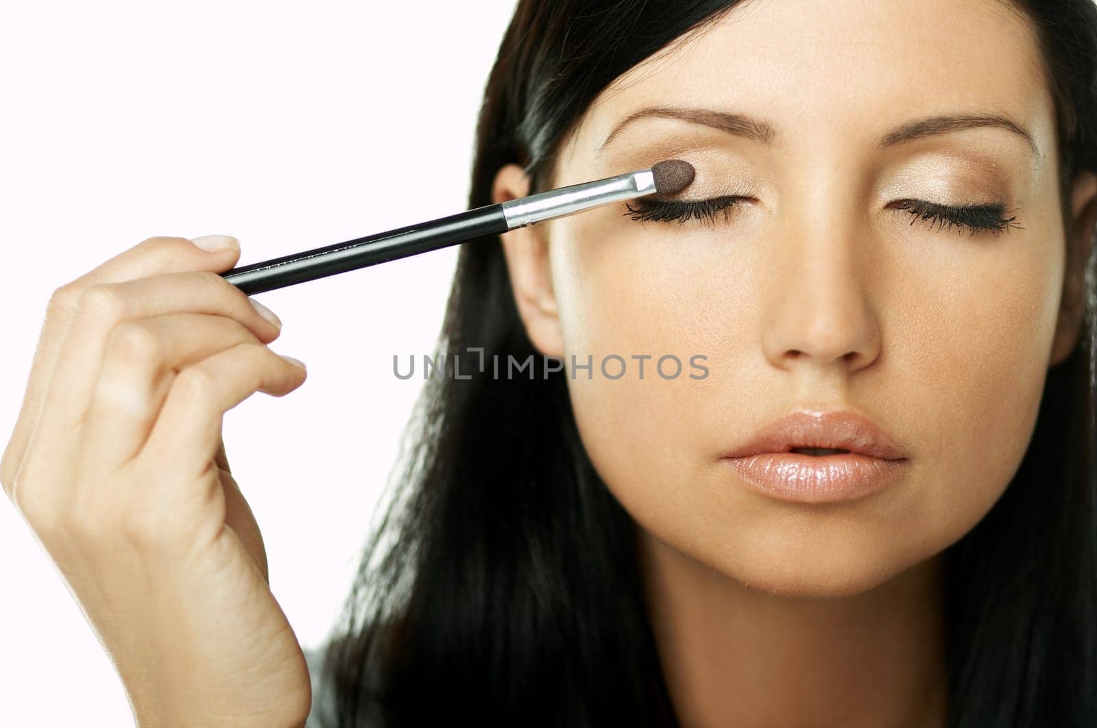Portrait of Beautiful brunette woman doing daily morning routines (the make up series)