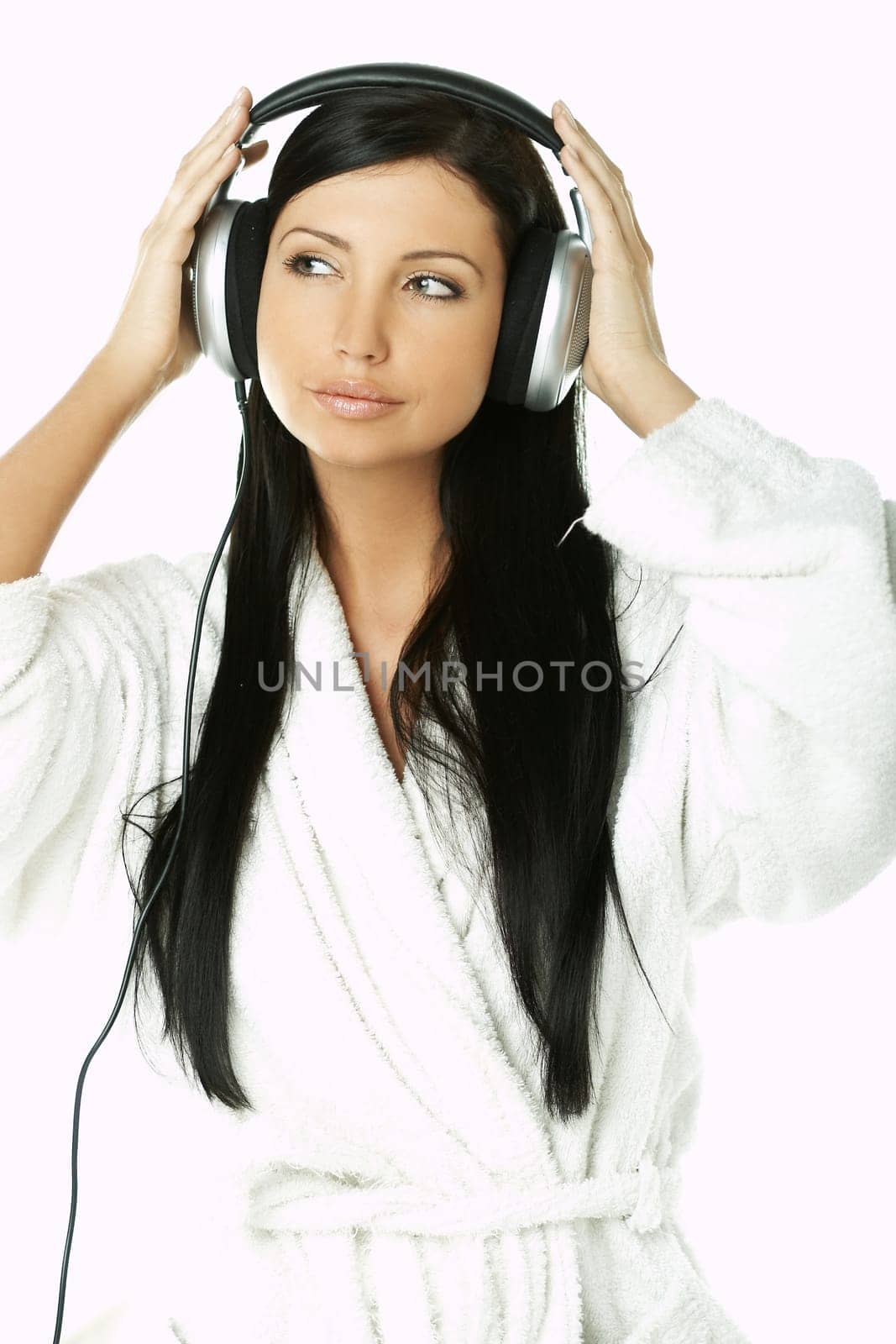 Portrait of Beautiful brunette woman listen to music with headphones