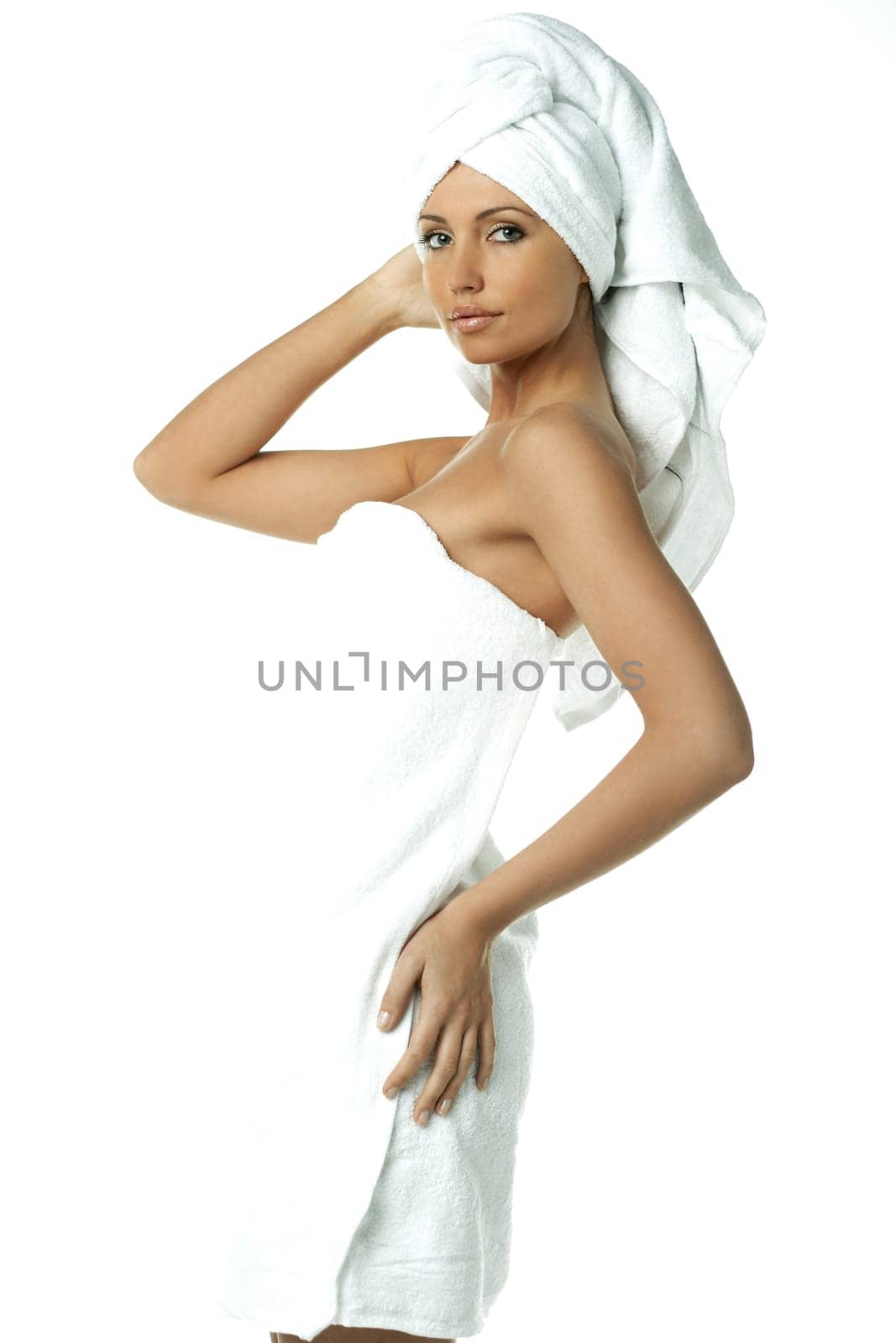 Portrait of Fresh and Beautiful brunette woman wearing white towel on her head