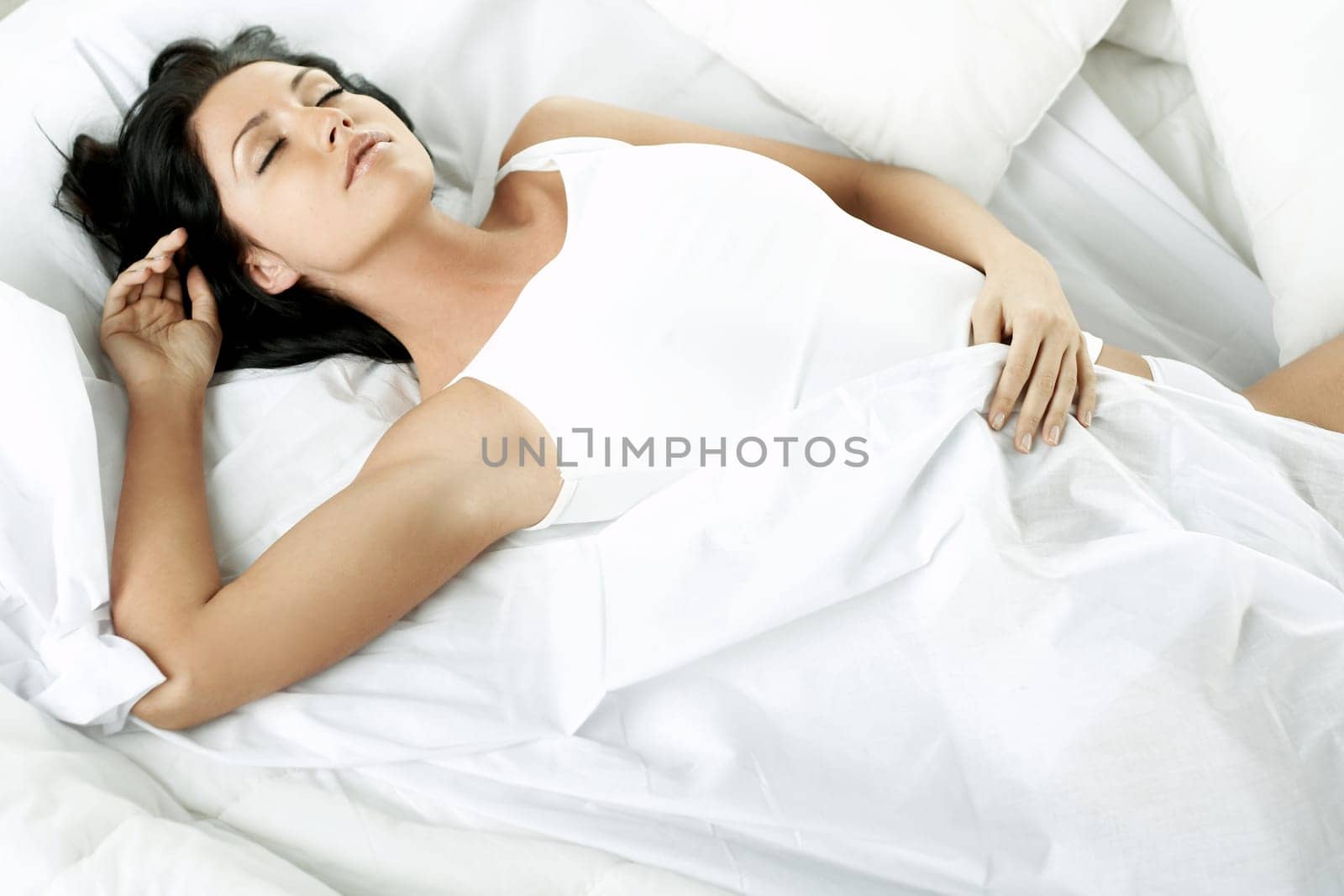 Portrait of Fresh and Beautiful brunette woman on bed