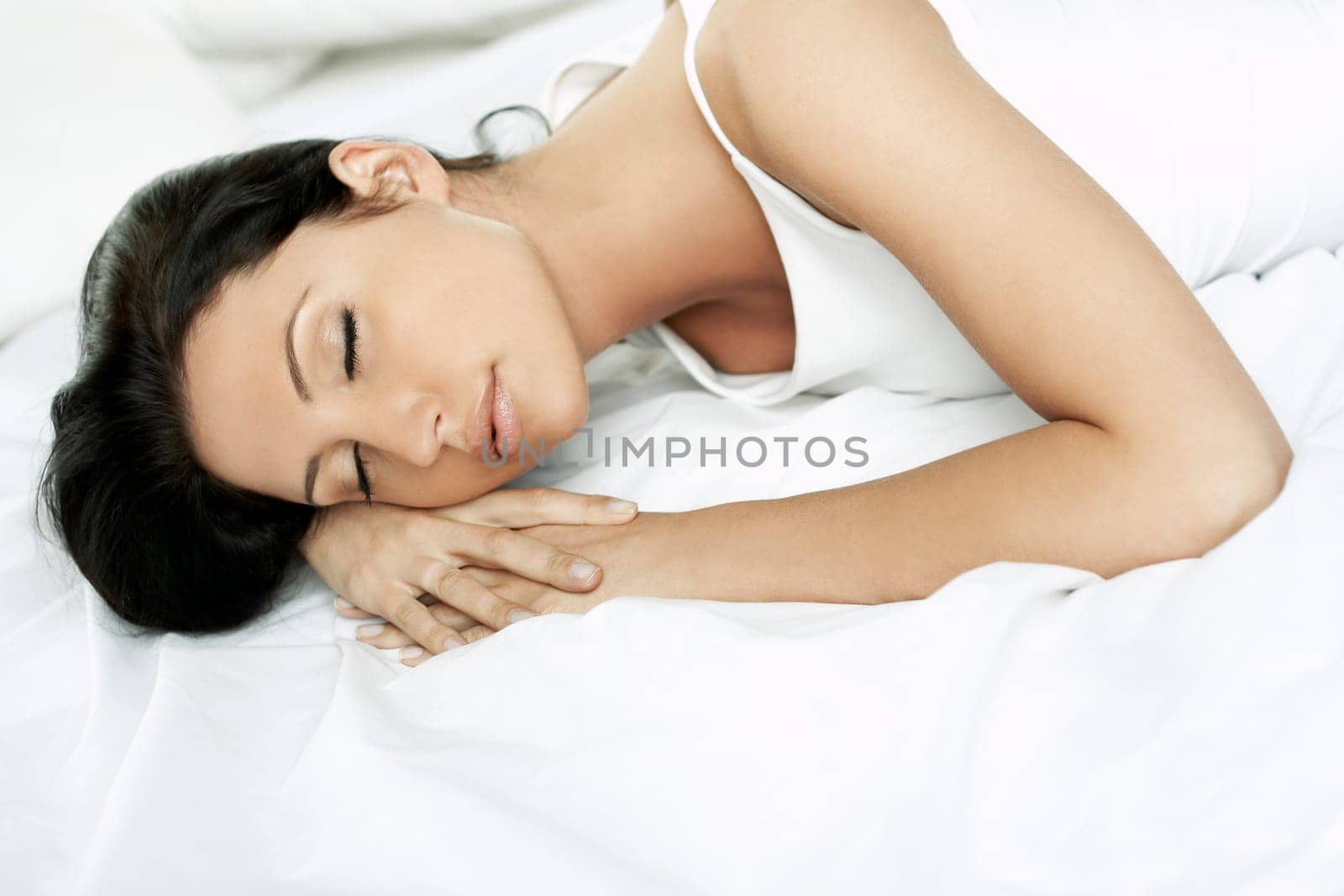 Portrait of Fresh and Beautiful brunette woman on bed
