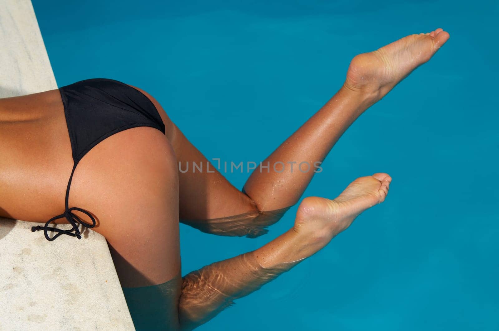 Beautiful young Sexy woman body in bikini in swimming pool