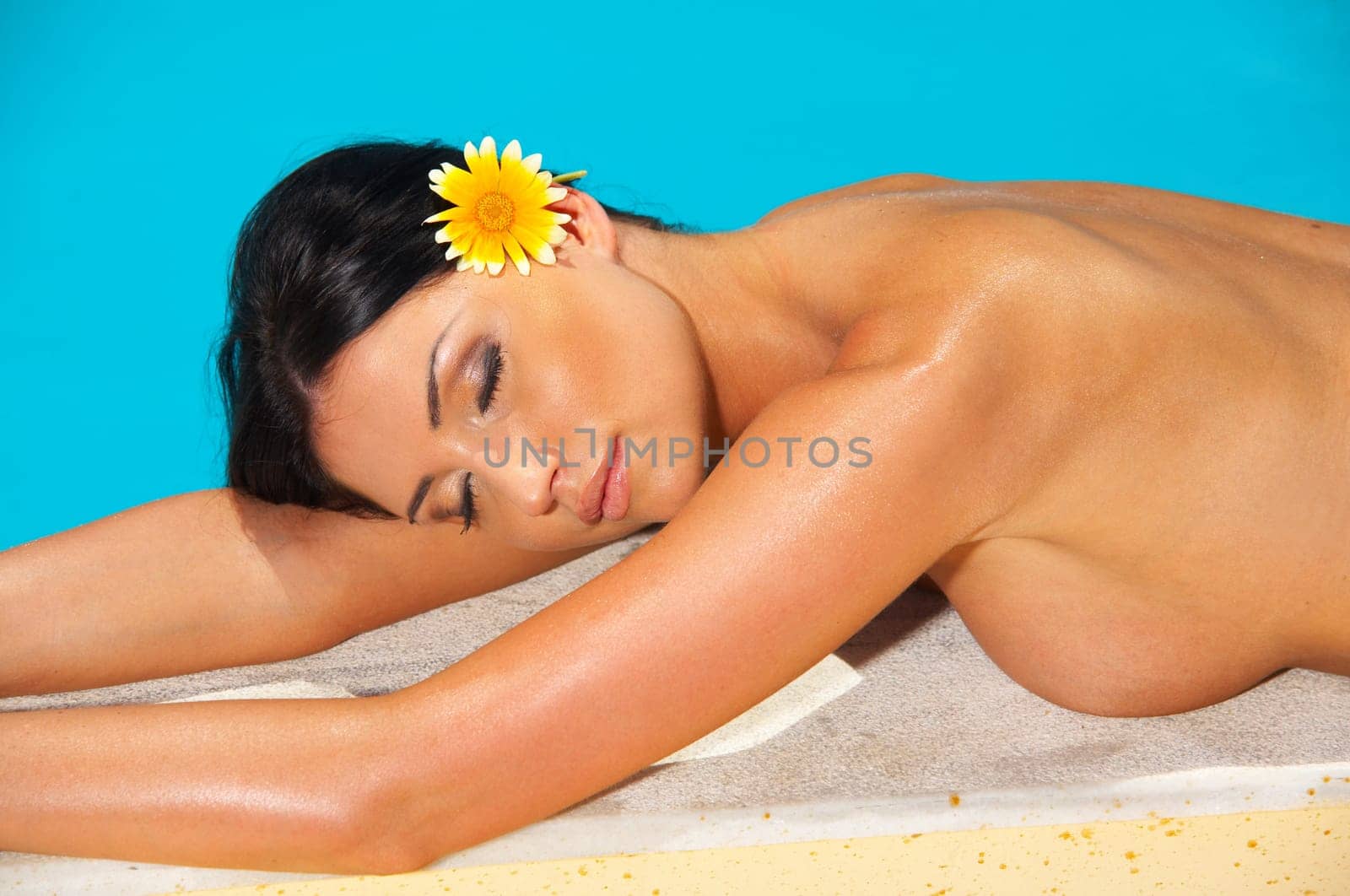 Beautiful young Sexy woman laying in bikini during sunbath next to swimming pool