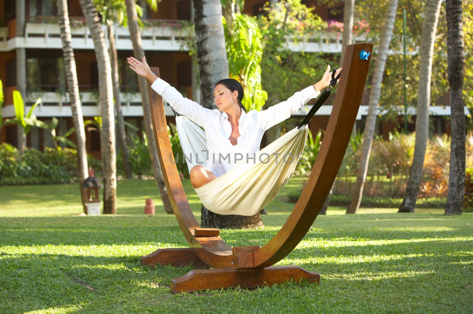 20-25 years woman portrait ralaxing on hammock at exotic surrounding, bali indonesia
