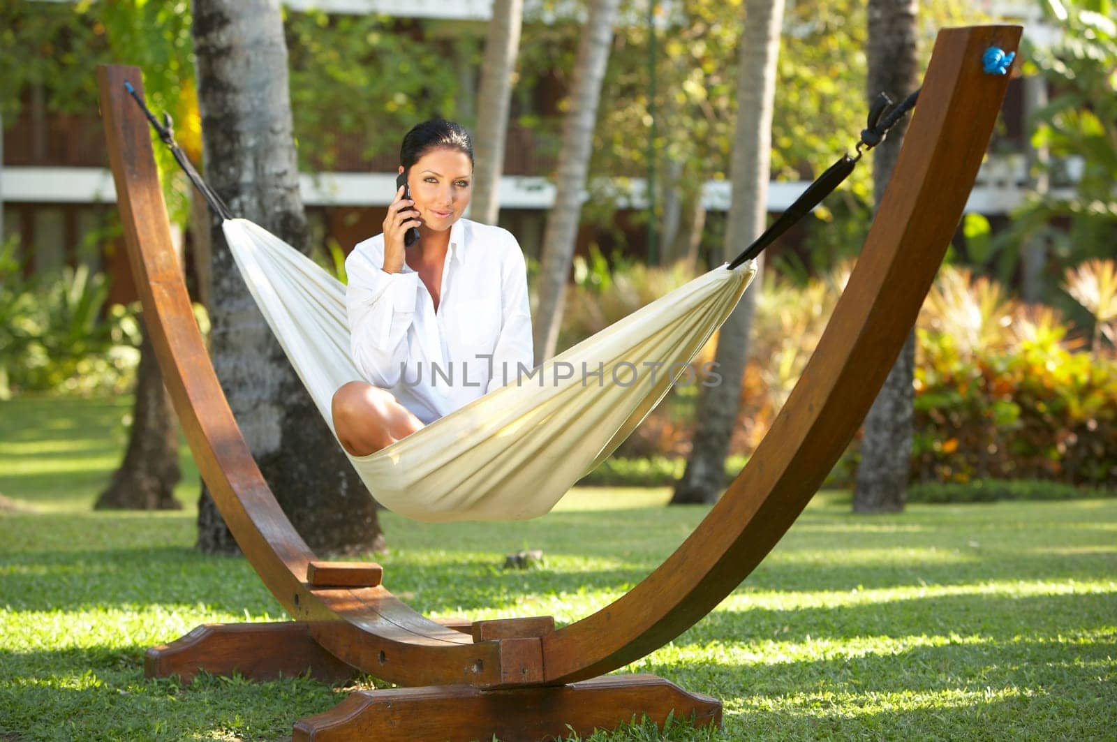 20-25 years woman portrait ralaxing on hammock at exotic surrounding, bali indonesia