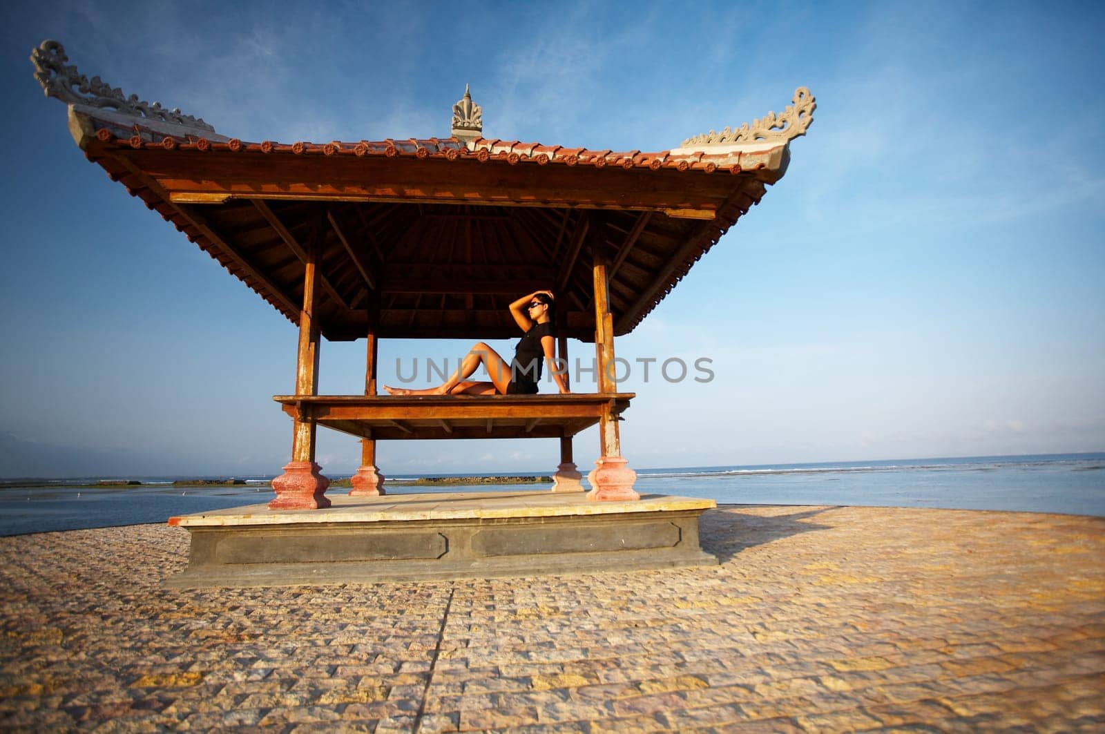 20-25 years woman portrait relaxing at seaside, bali indonesia