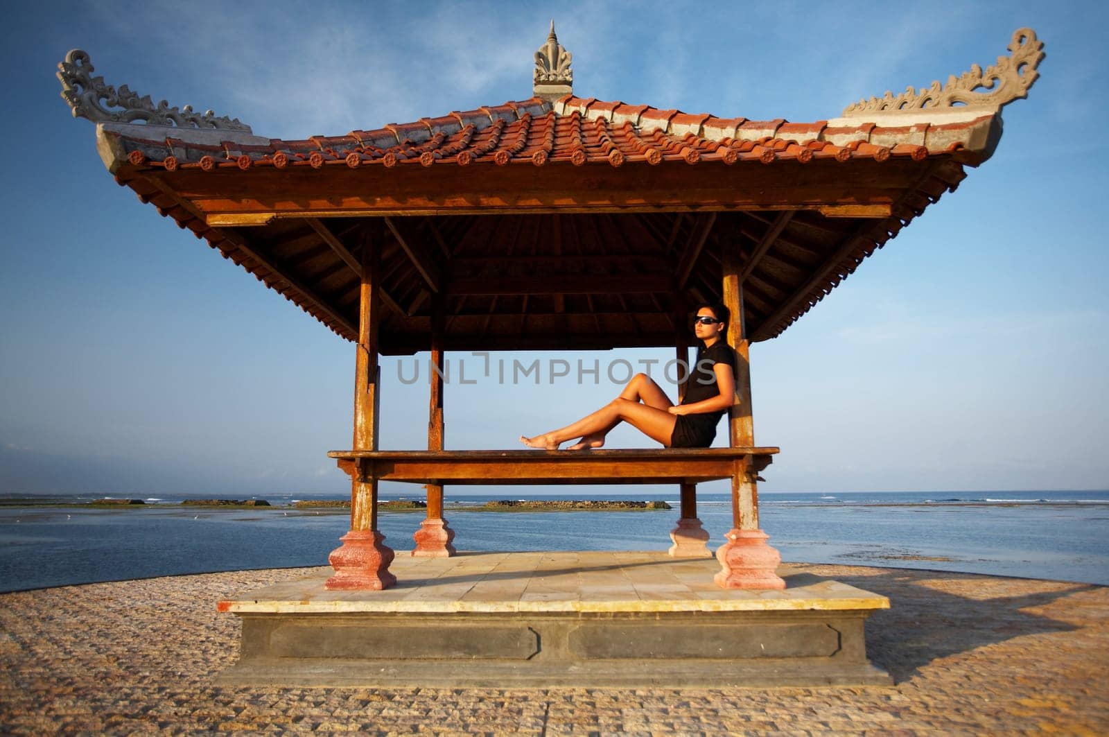 20-25 years woman portrait relaxing at seaside, bali indonesia