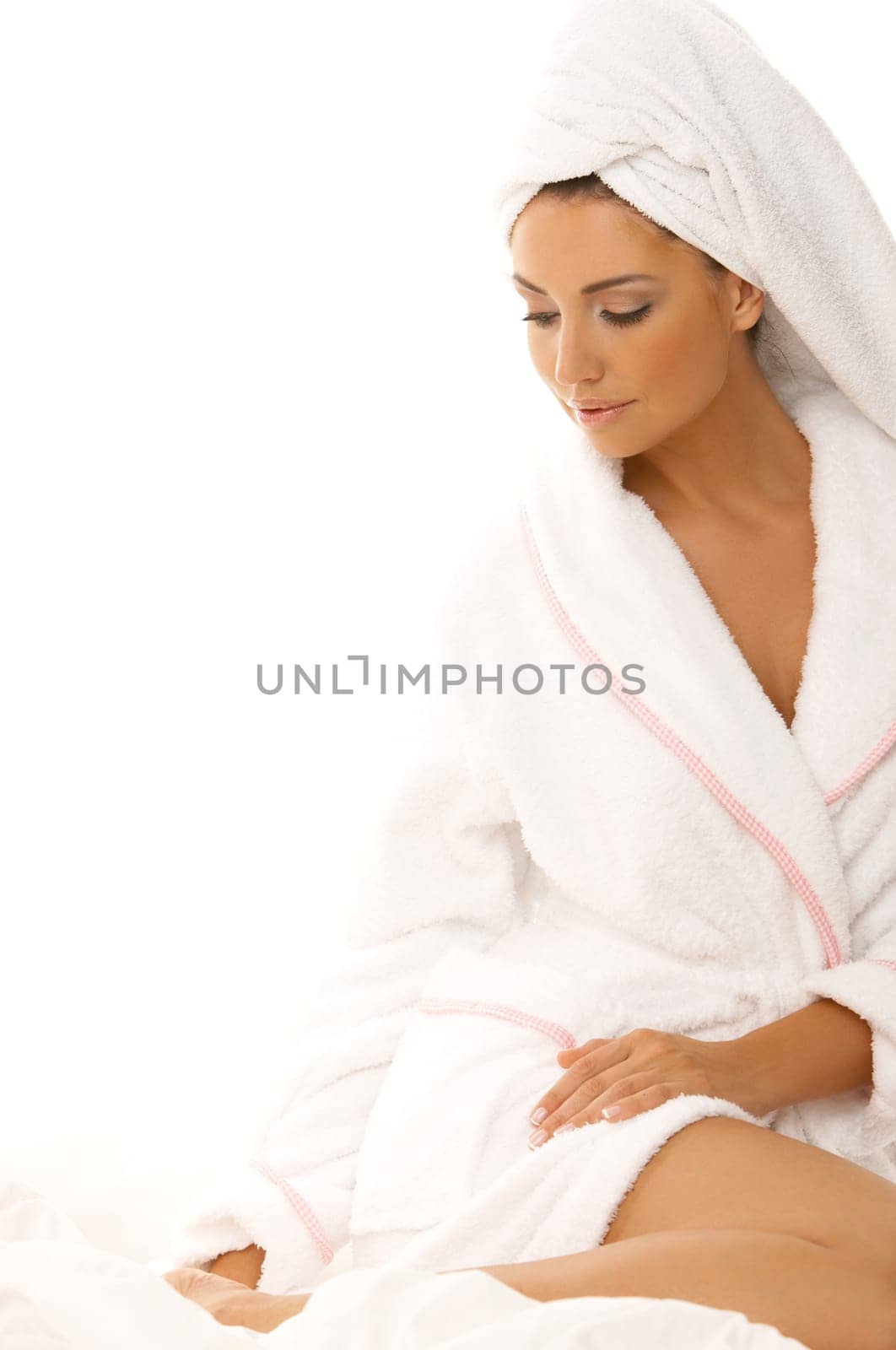 Portrait of 20-25 years old beautiful woman on white bed