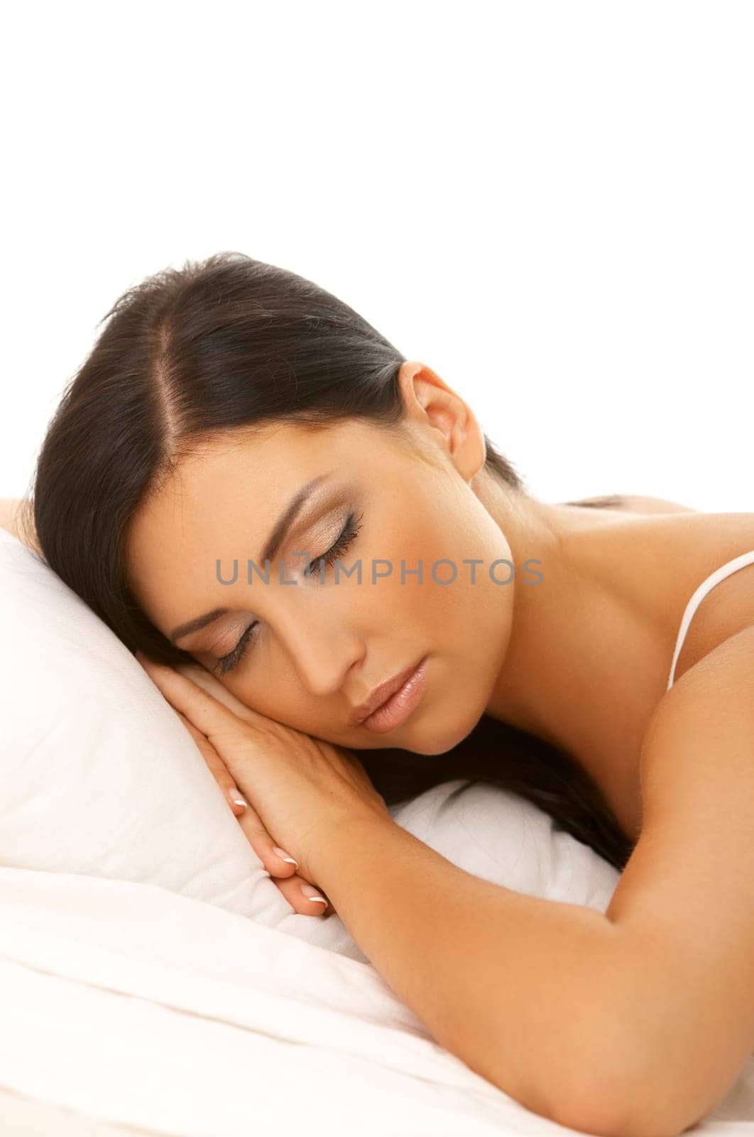 Portrait of 20-25 years old beautiful woman on white bed