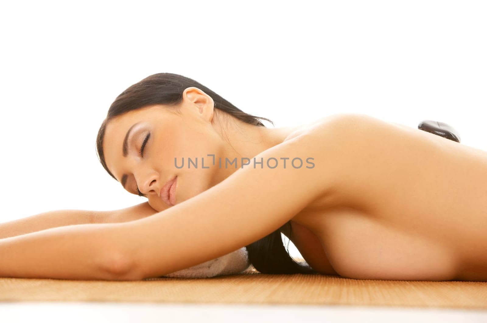 Portrait of Fresh and Beautiful brunette woman taking stone therapy
