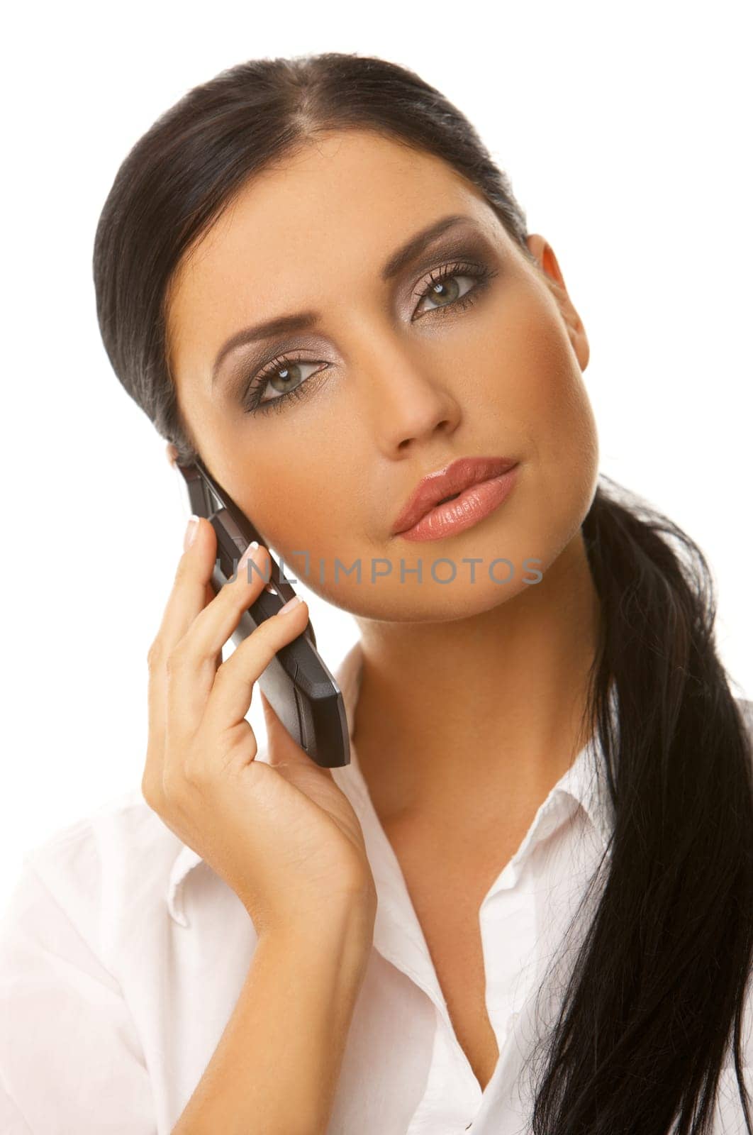 Beautiful business woman is using mobile telephone