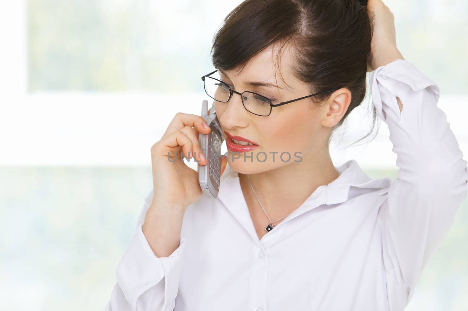 Beautiful business woman is working in her office