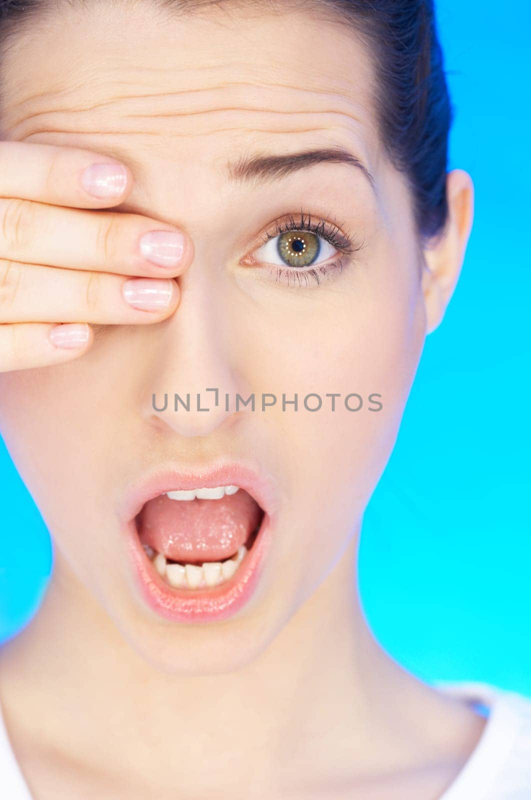 Portrait of 20-25 years old beautiful woman with eye covered by hand