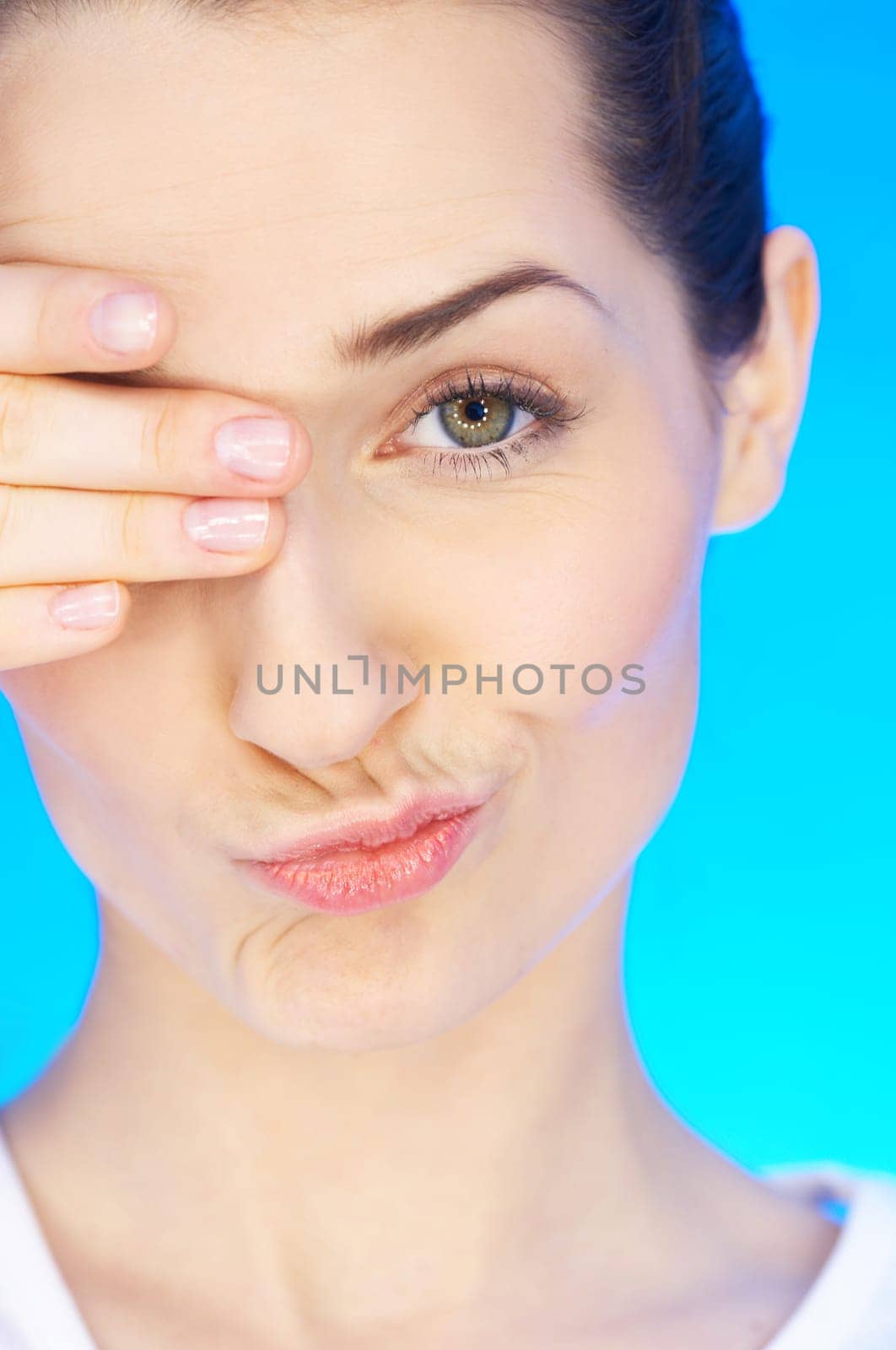 Portrait of 20-25 years old beautiful woman with eye covered by hand