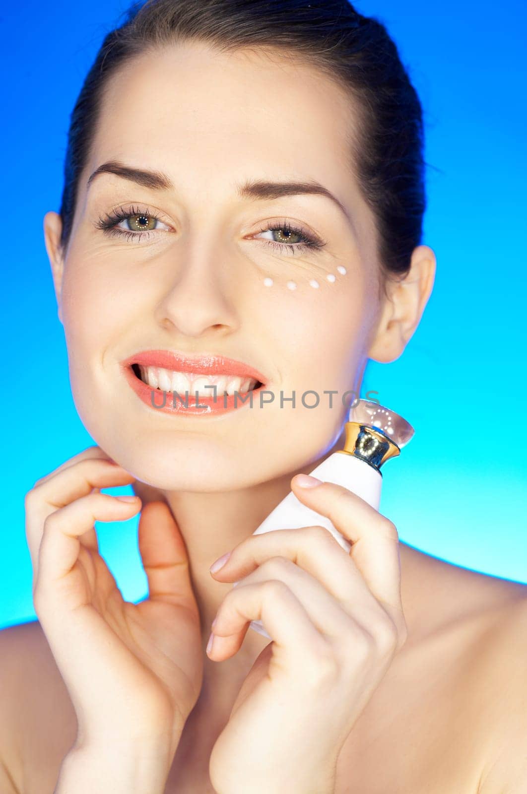 Portrait of beautiful woman with cream spots on face
