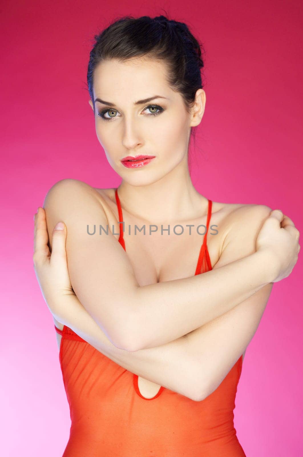 Portrait of beautiful woman on pink background