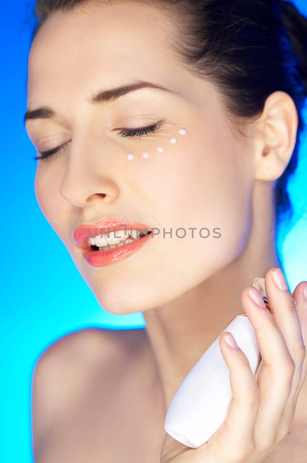 Portrait of 20-25 years old beautiful woman with cream
