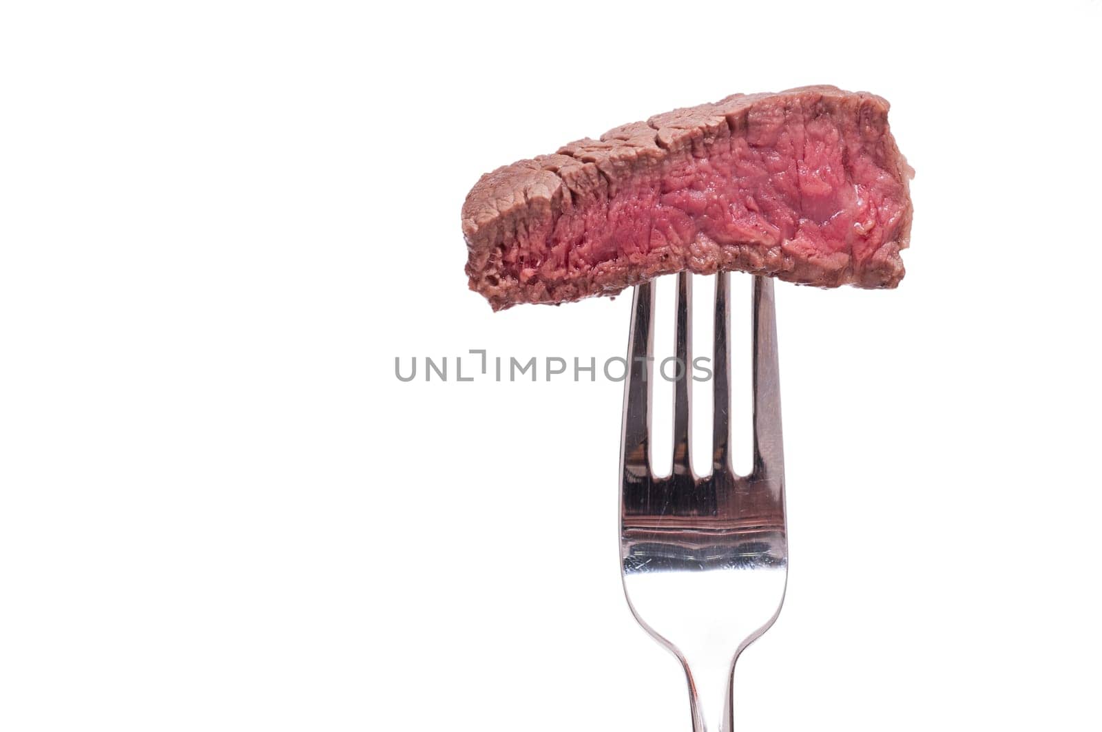 Pink roasted beef on a fork white isolated