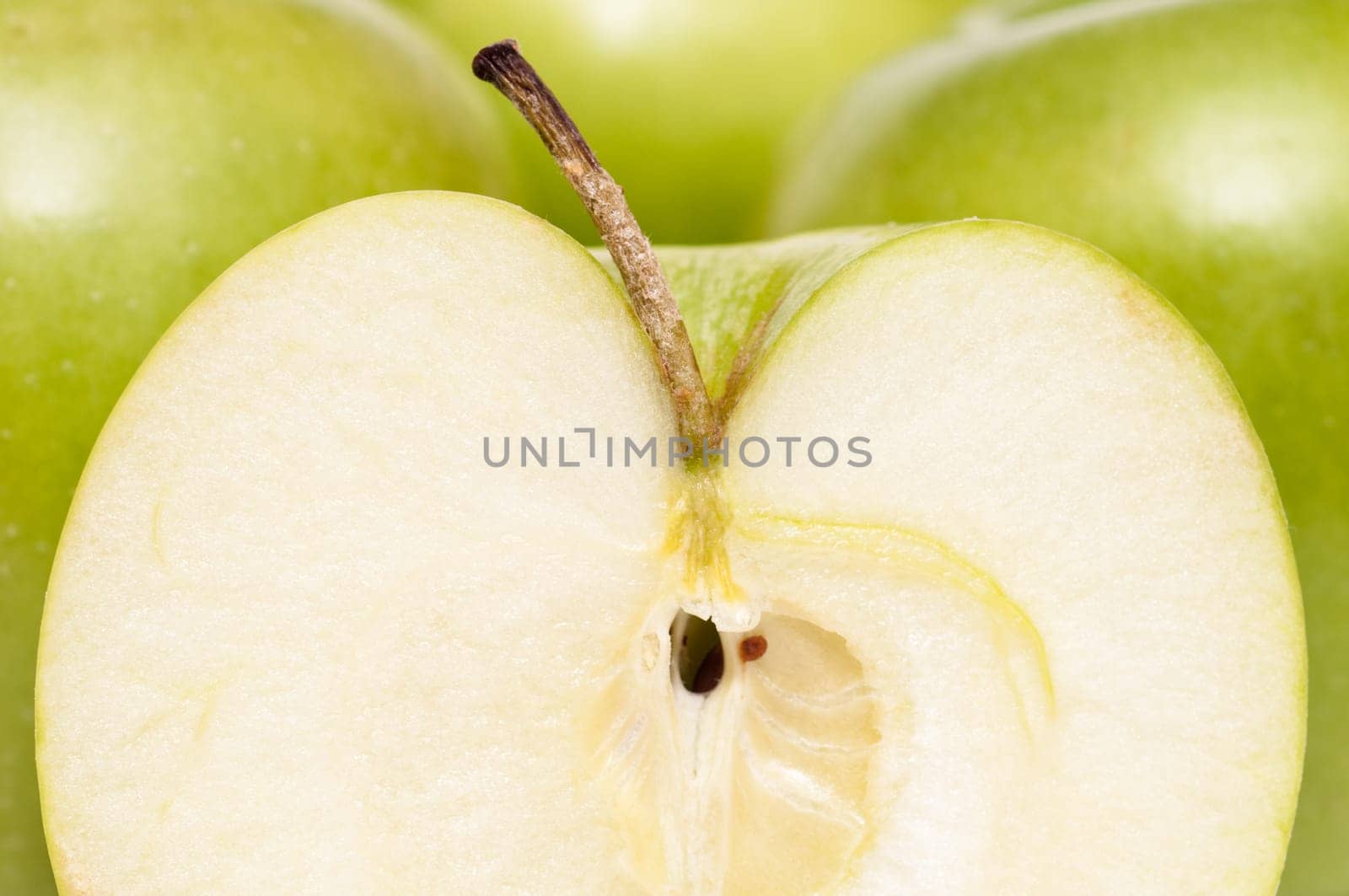 Slice of a green Golden Delicious apple