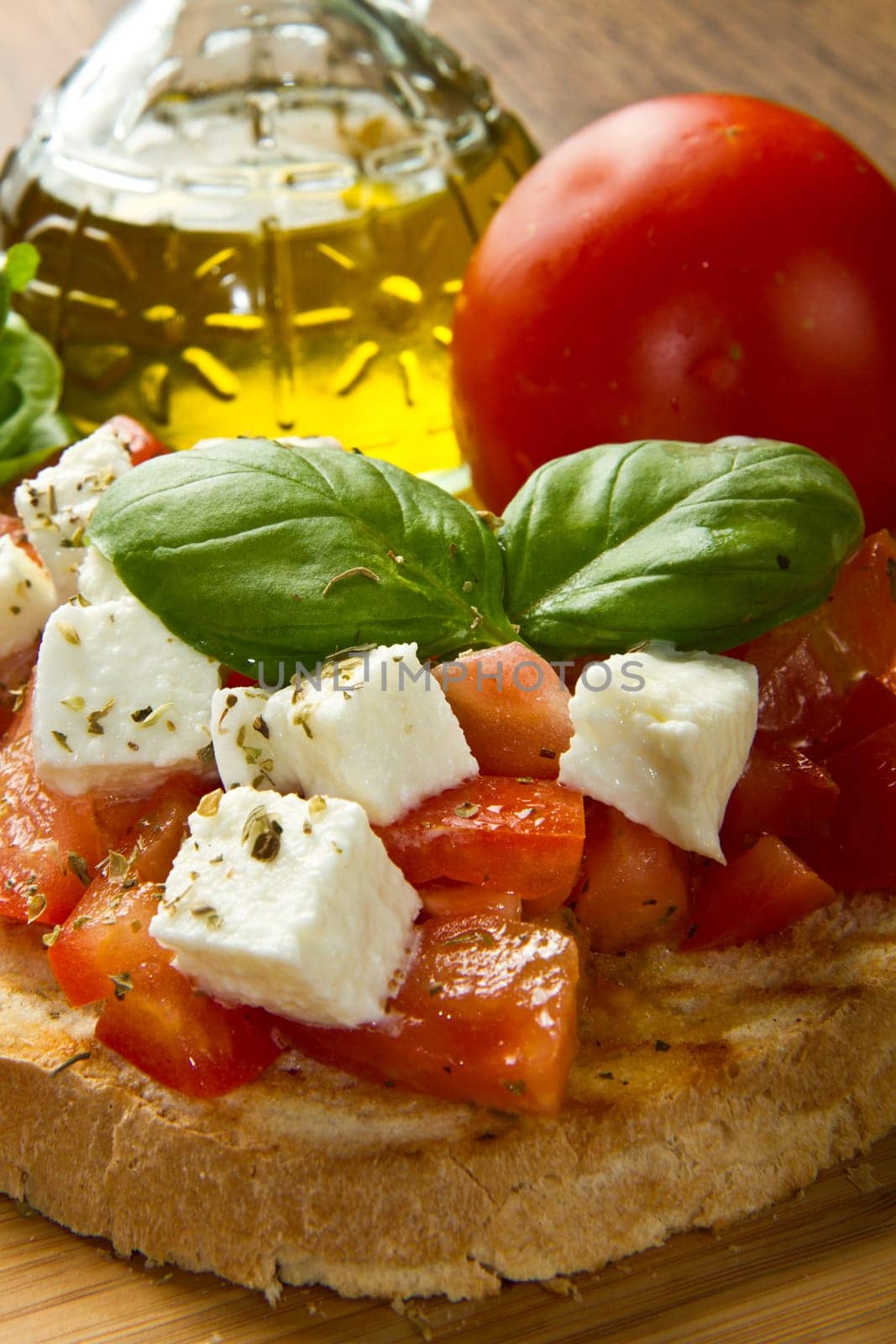 italian bruschetta with fresh tomatoes, basil, garlic, olive oil and cheese