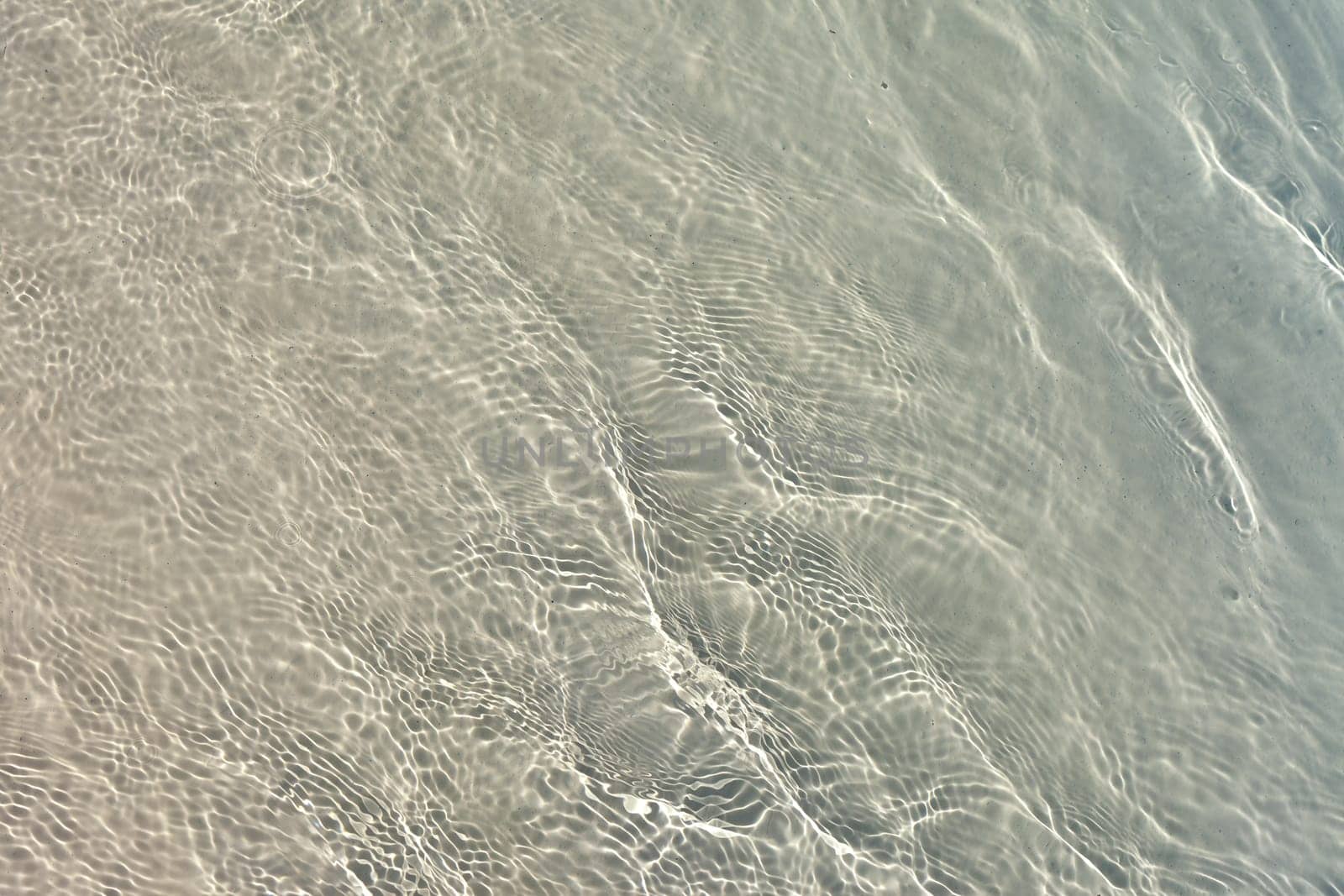 The Blue sea water with sunlight reflections