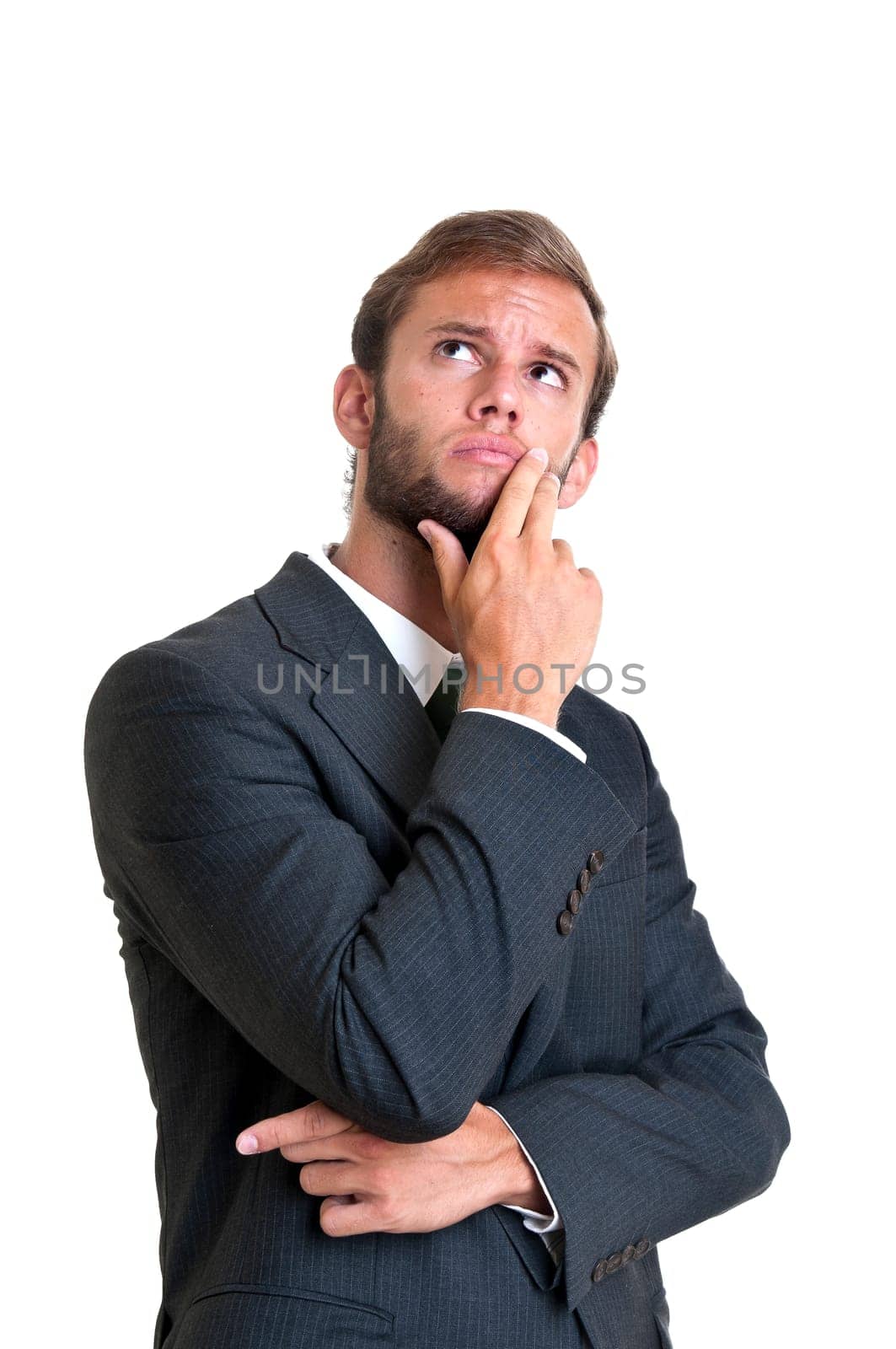 Young businessman thinking isolated in white