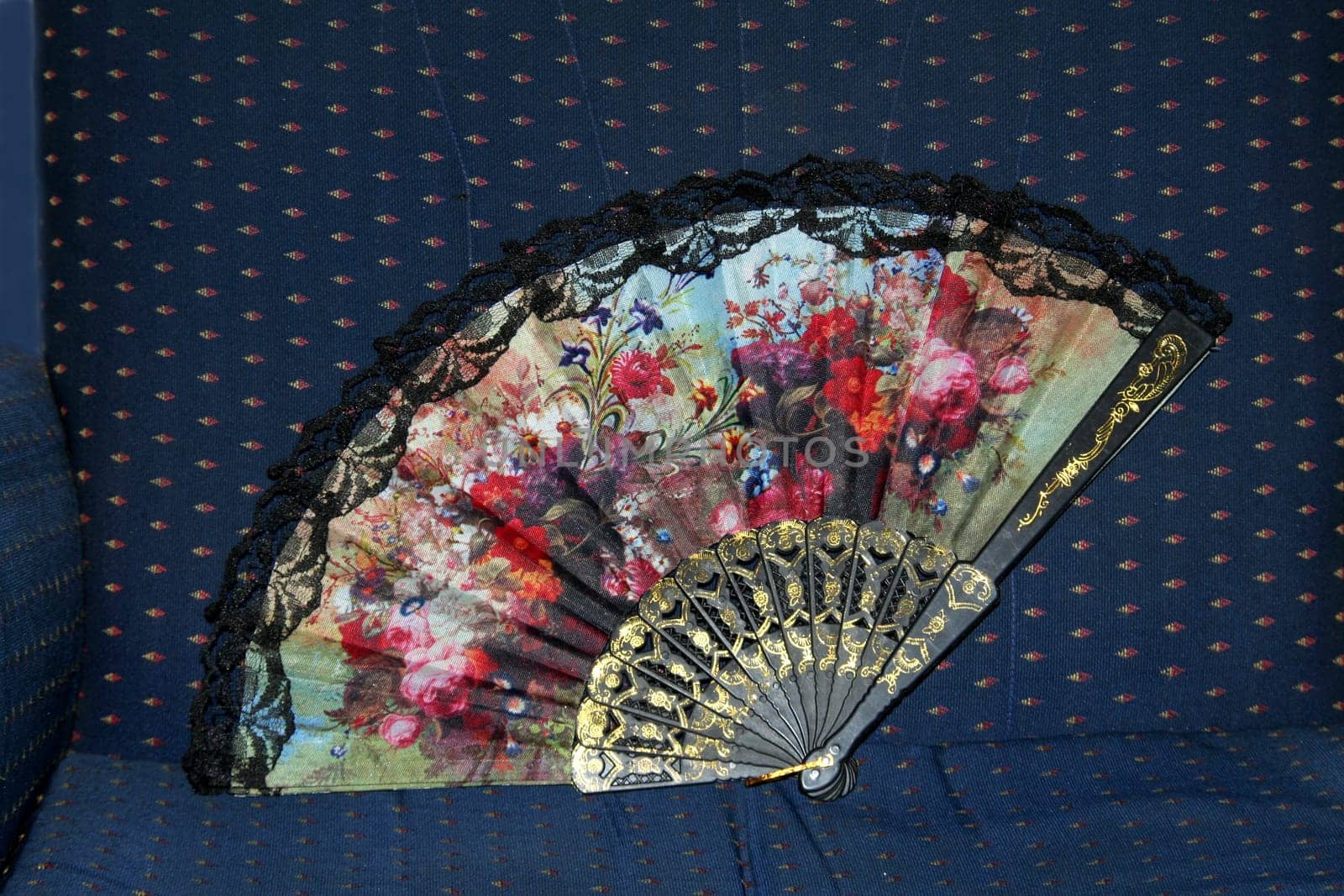 Colourful  floral design on fabric hand fan