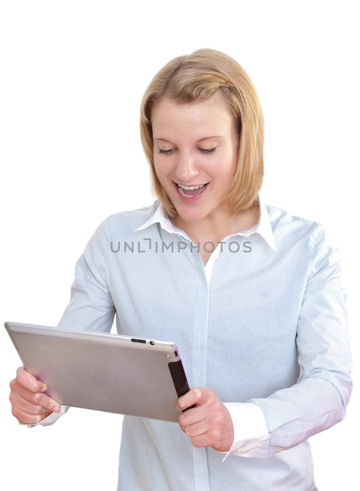 Young woman looking enthusiastically at her tablet PC