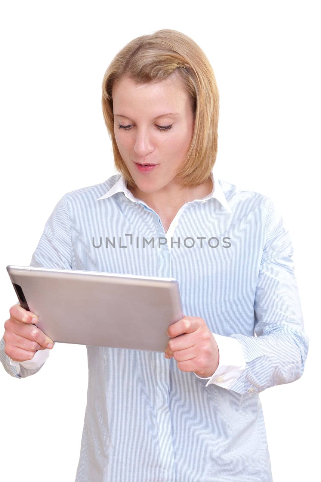 Young woman looking at her tablet PC in amazement